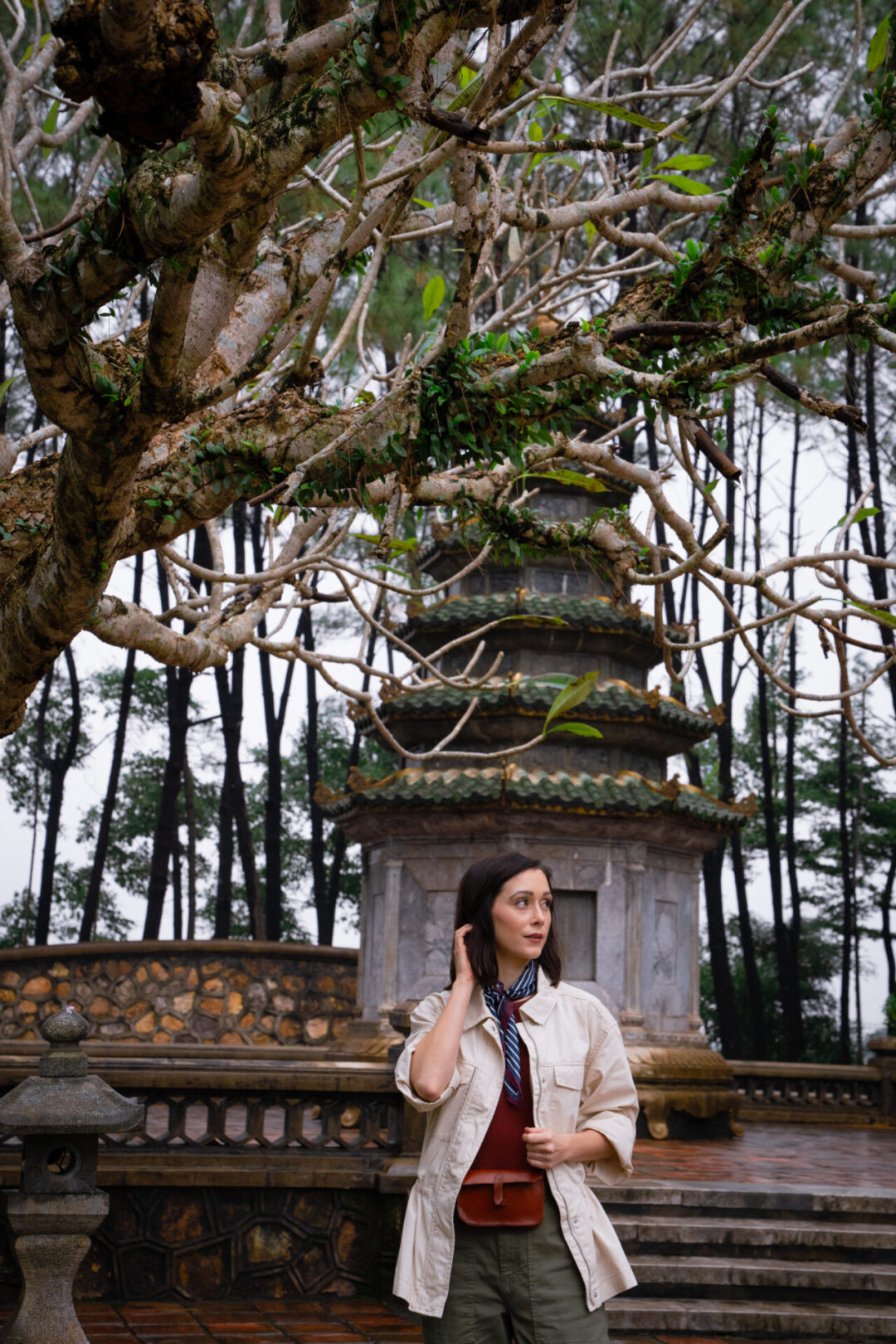 Travel Blogger Jordan Gassner walking along the grounds at Thien Mu Pagoda in Hue, Vietnam