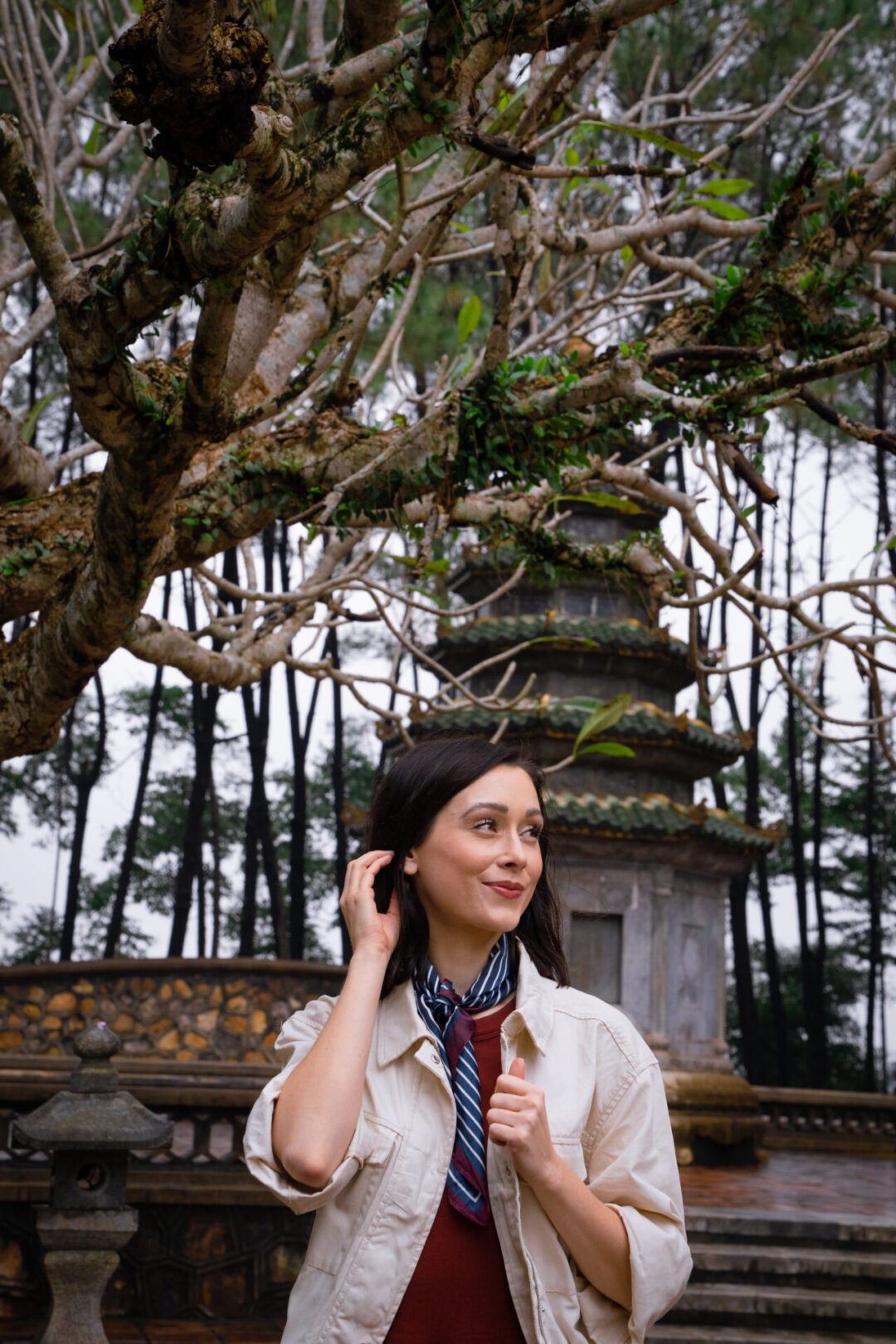 Travel Blogger Jordan Gassner smiling at Thien Mu Pagoda in Hue Vietnam