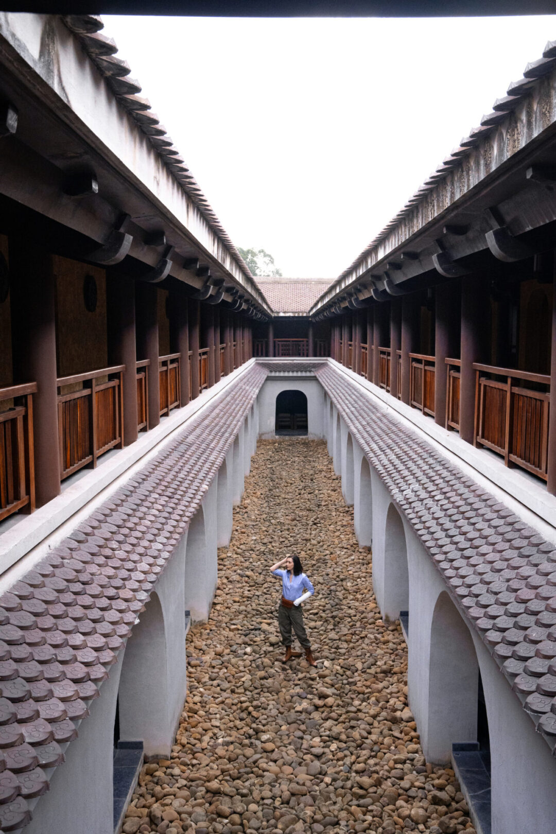 Travel Blogger Jordan Gassner standing inside the symmetrical rock garden at Legacy Yen Tu - MGallery retreat in Northern Vietnam