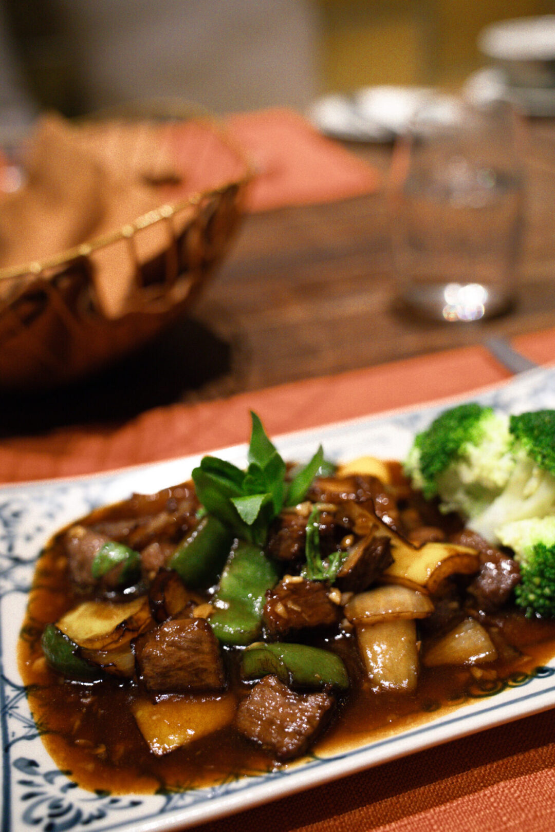 A blue and white plate filled with Shaking Buffalo Luc Lac from Legacy Yen Tu in Vietnam