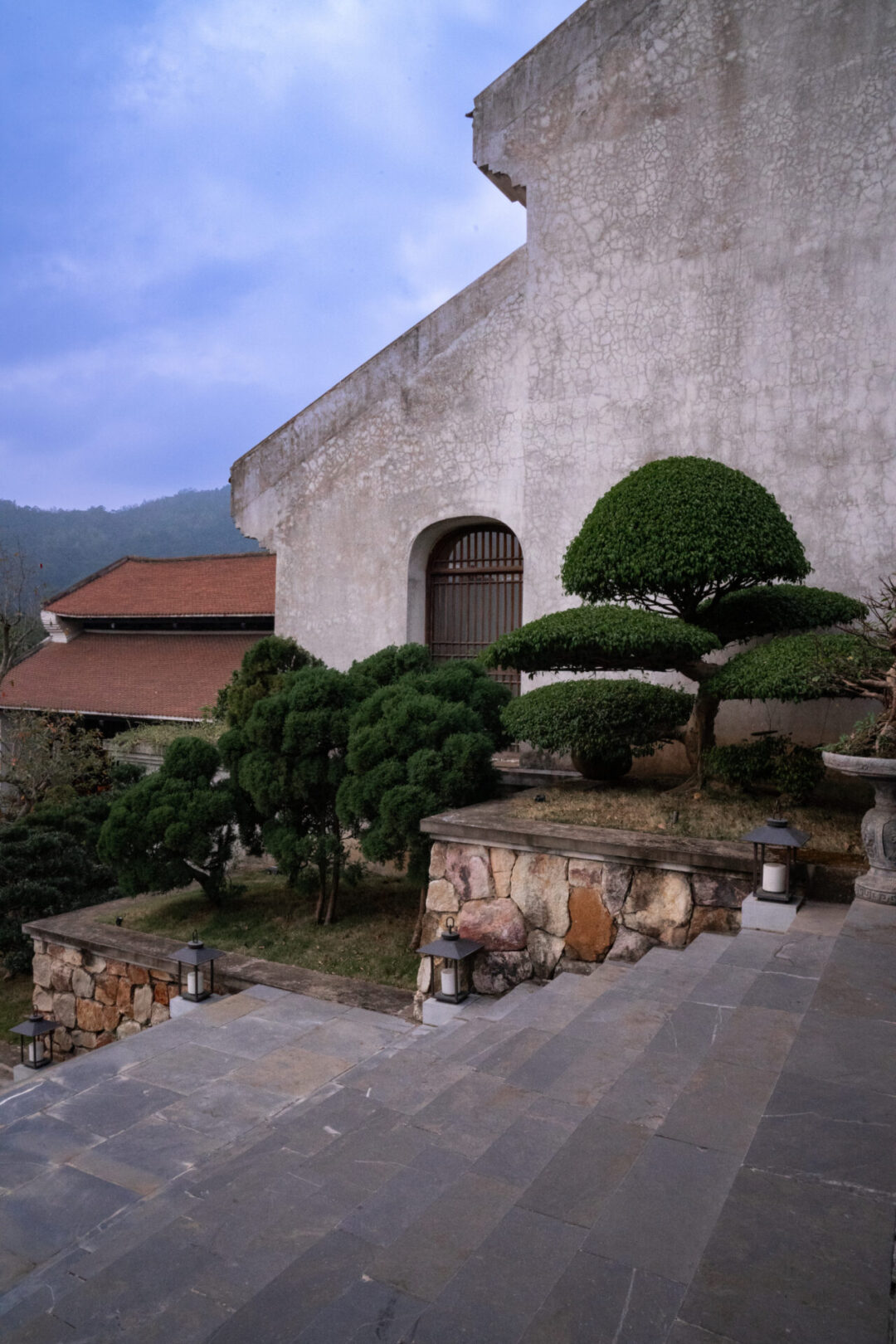 A picturesque and traditionally designed staircase at Legacy Yen Tu Resort in Vietnam, a 5 star hotel.