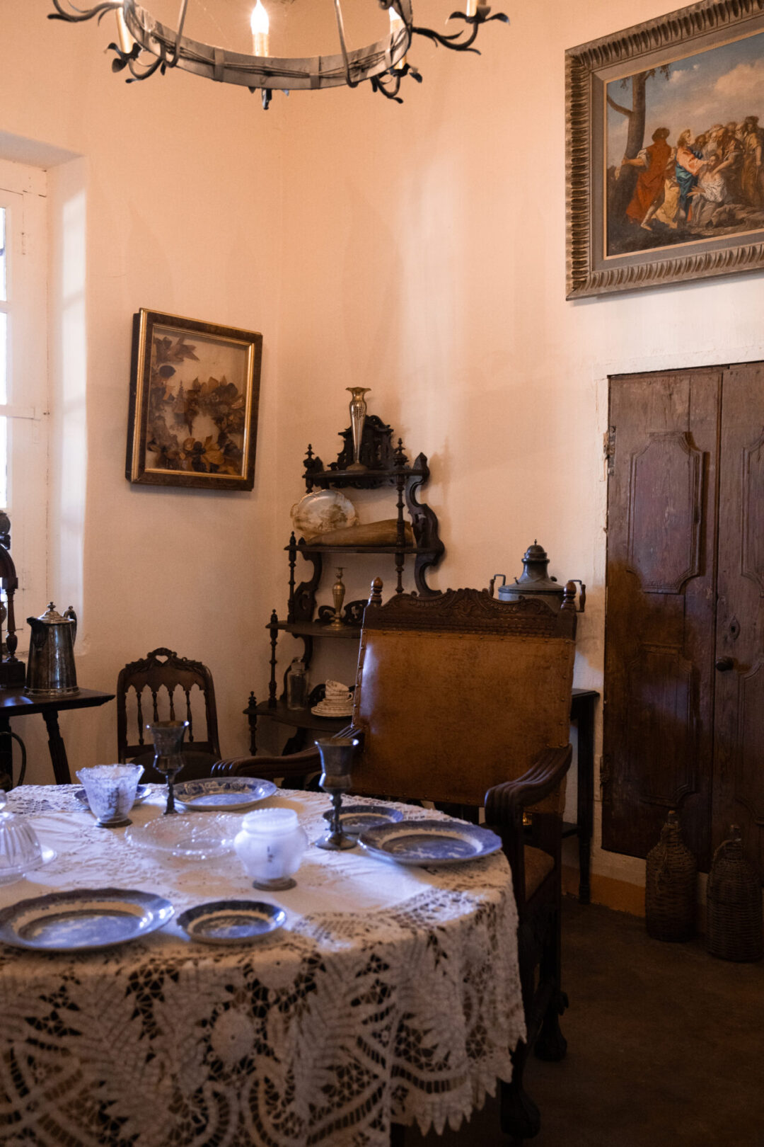 A display of old furniture and dishes inside Mission San Luis Obispo De Tolosa in Central California