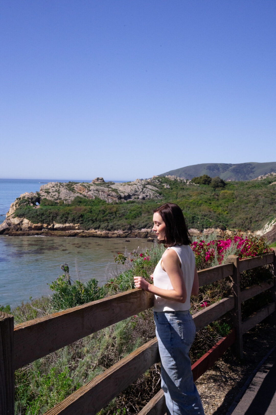Travel Blogger Jordan Gassner standing along a trail near Pirate's Cove Cave in San Luis Obispo, California