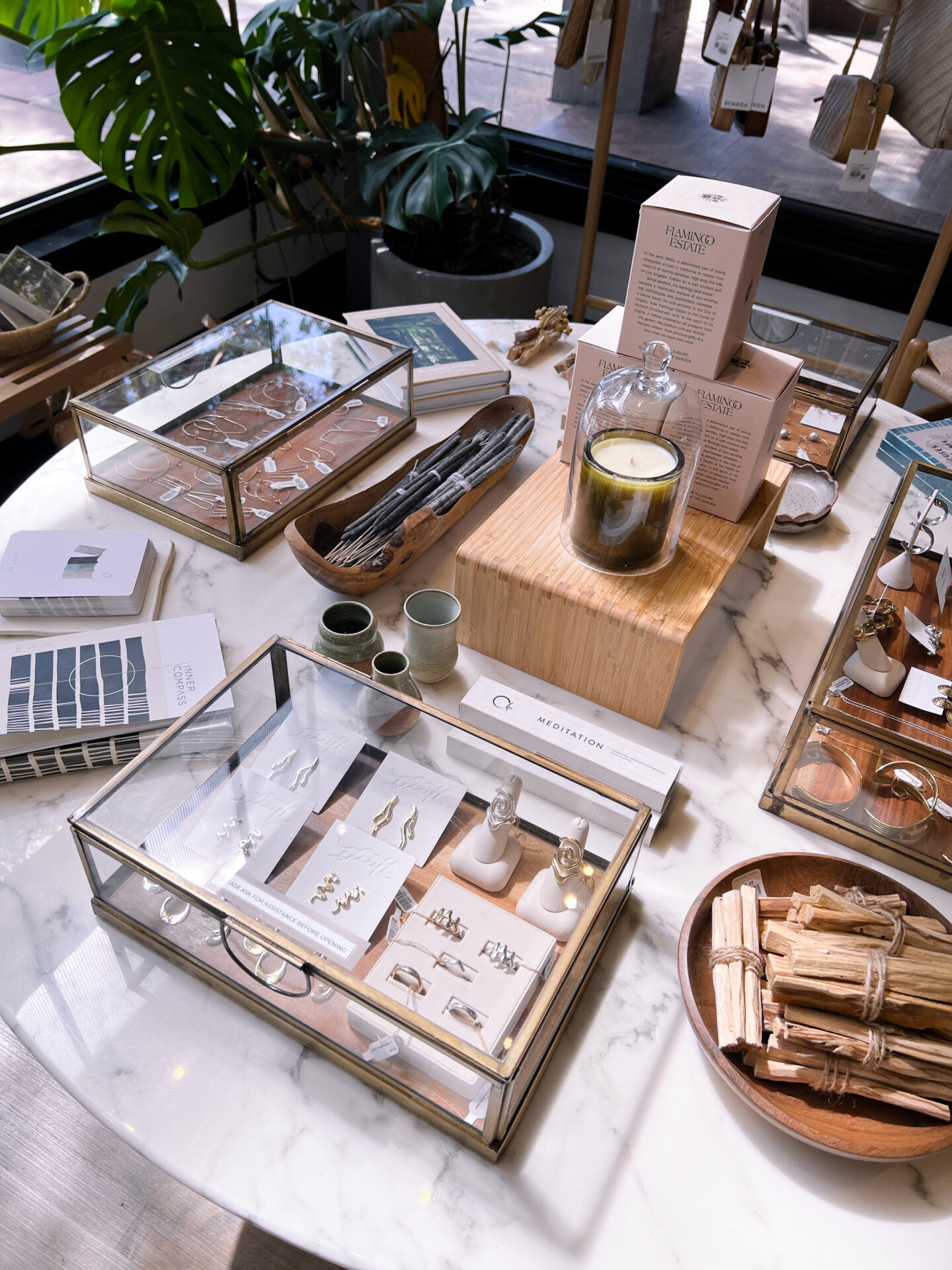 A table full of rings and earrings on display inside Len Collective, a jewelry store in Downtown San Luis Obispo, California