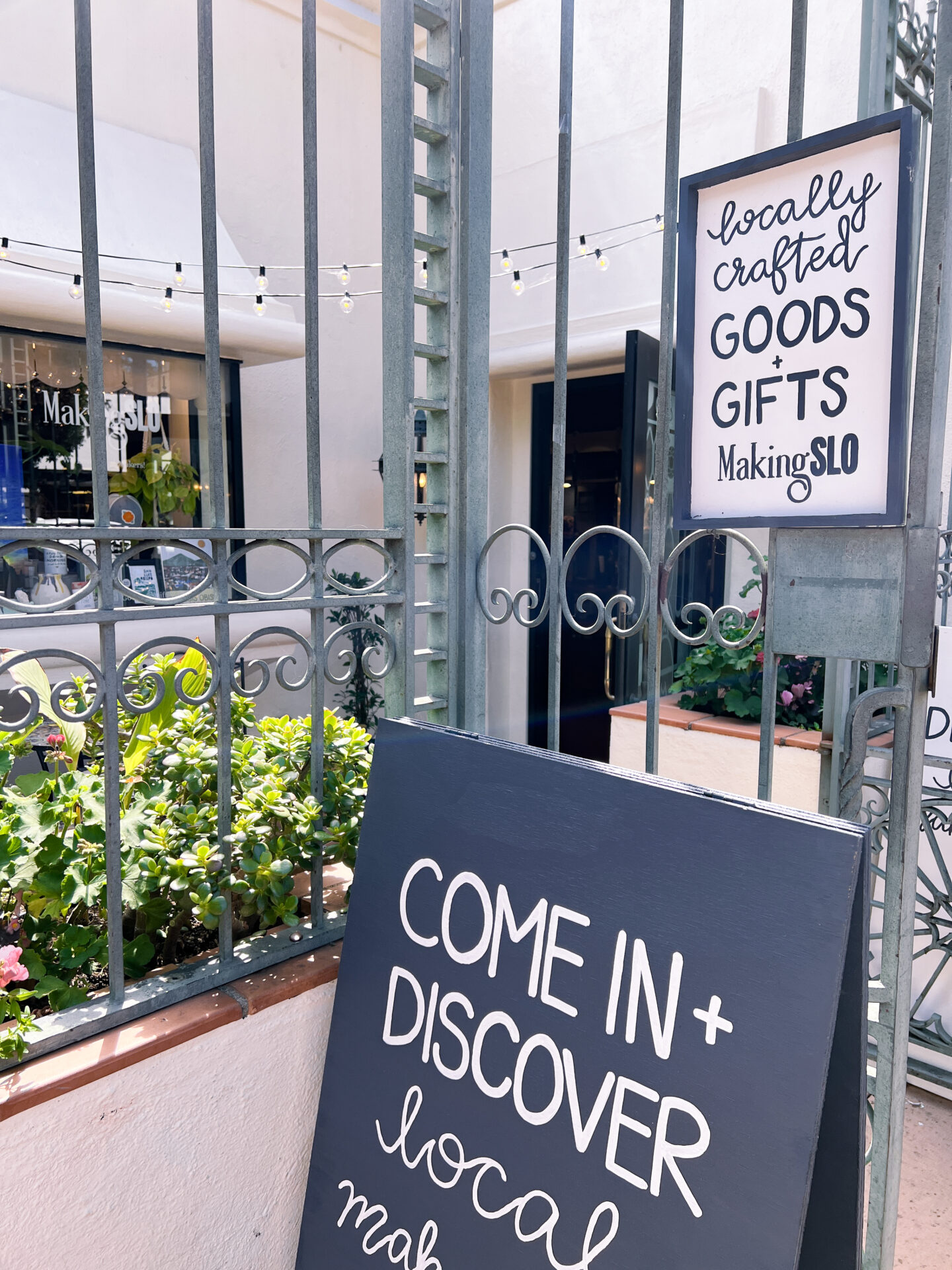 The sign and gate leading inside MakingSLO, a locally crafted goods and gifts store in Downtown San Luis Obispo, California