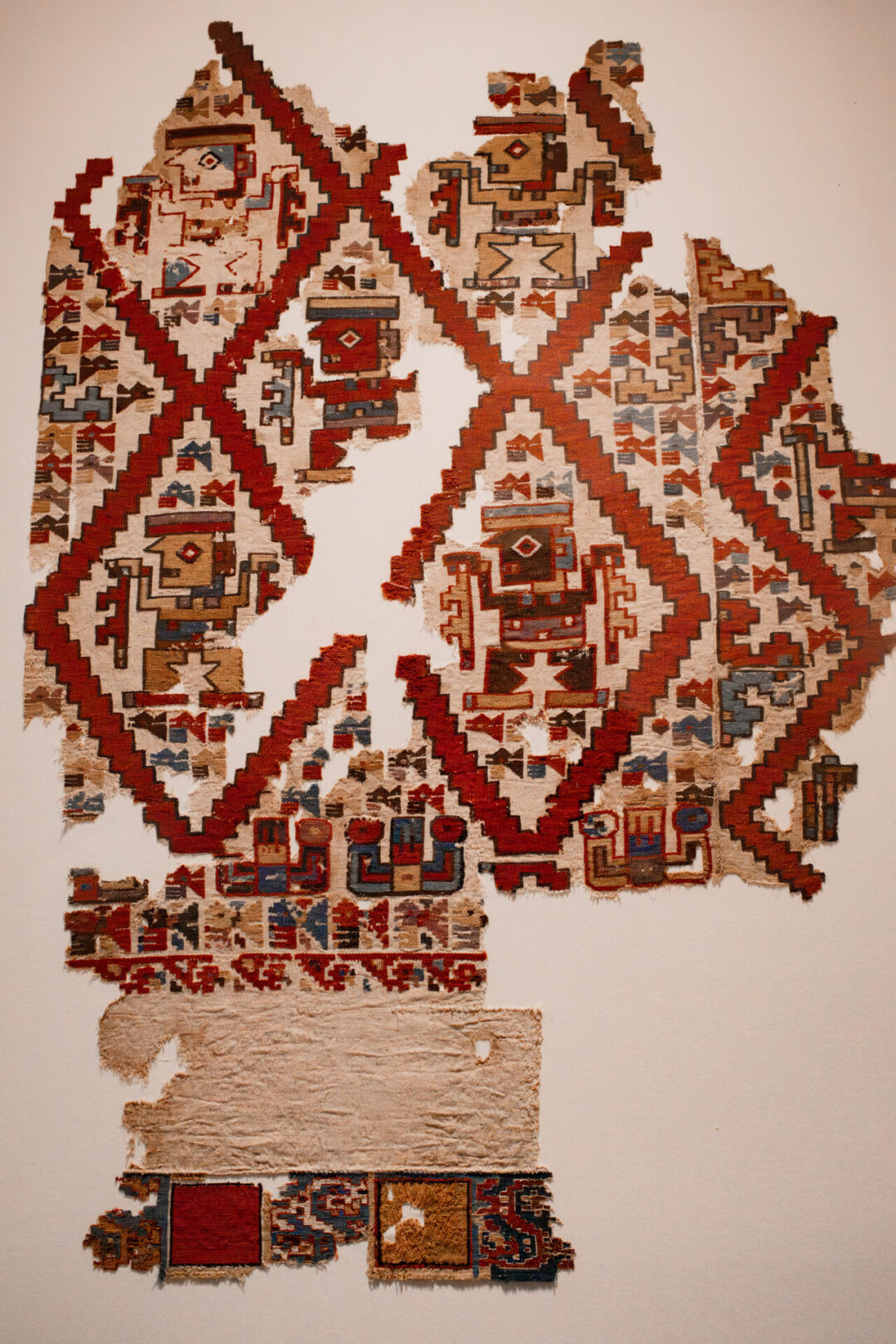 A colorful pre-Incan tapestry inside Larco Museum in Lima, Peru