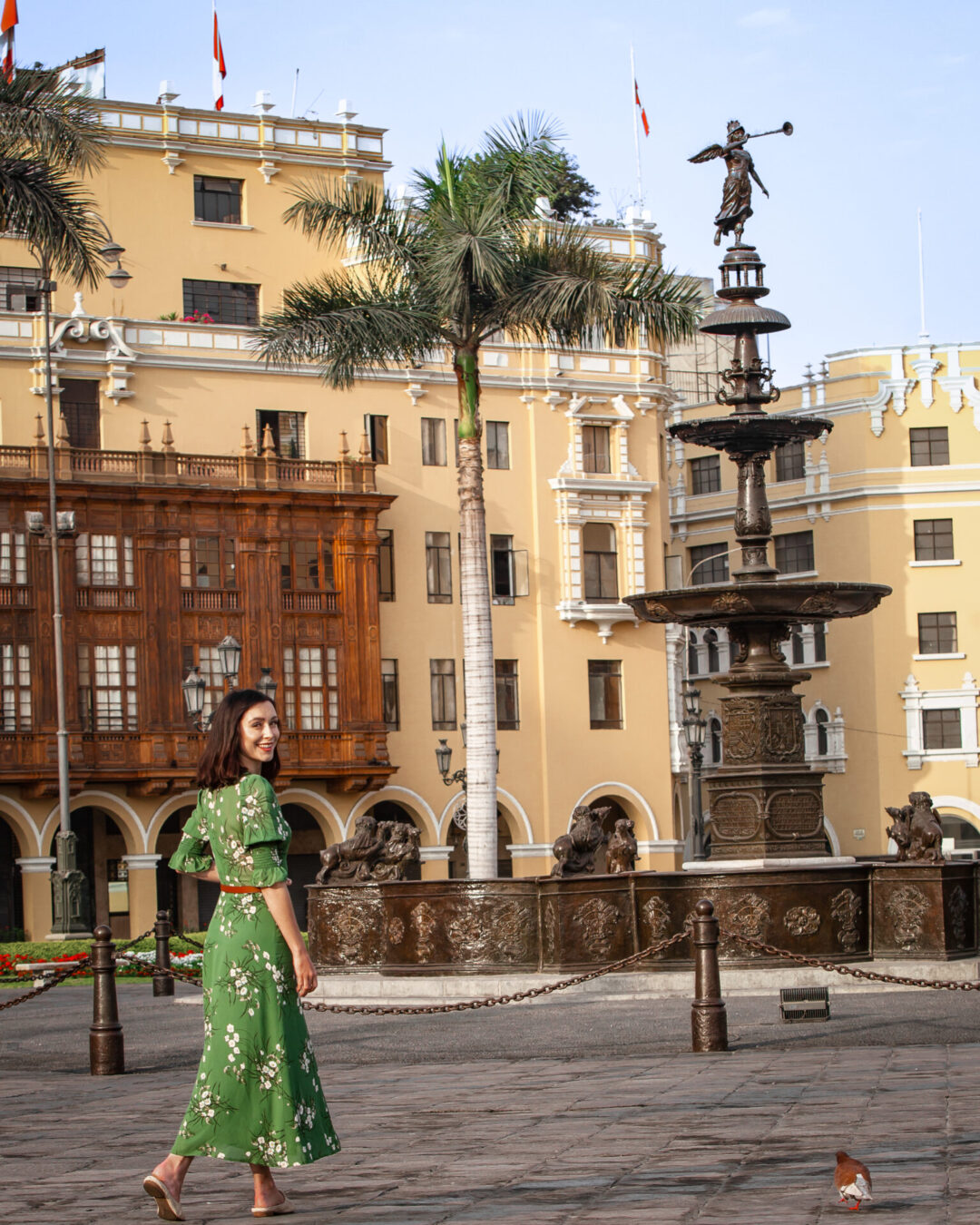 Travel Blogger Jordan Gassner standing near the fountain in Plaza Mayor in Lima, Peru