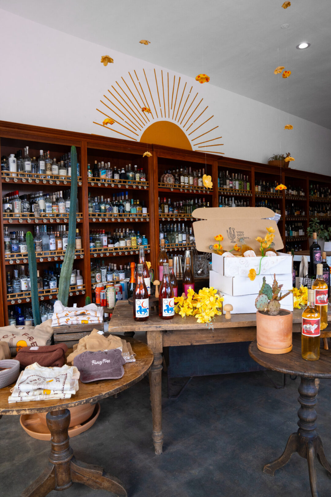 A display tble with natural wine and gift boxes inside Fancy Free Liquor in Burbank, California