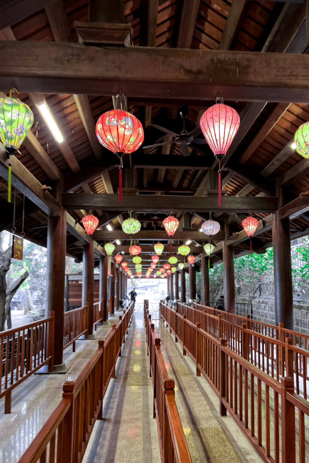 An empty, lantern-strewn queue leading up to the Trang An Boat Departure Area in Ninh Binh, Vietnam