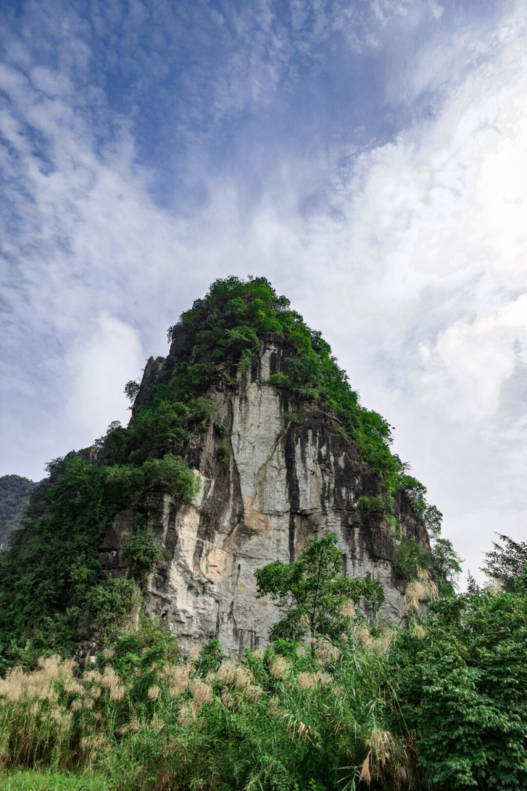 A large limestone karst in Trang An Landscape Complex in Ninh Binh, Vietnam
