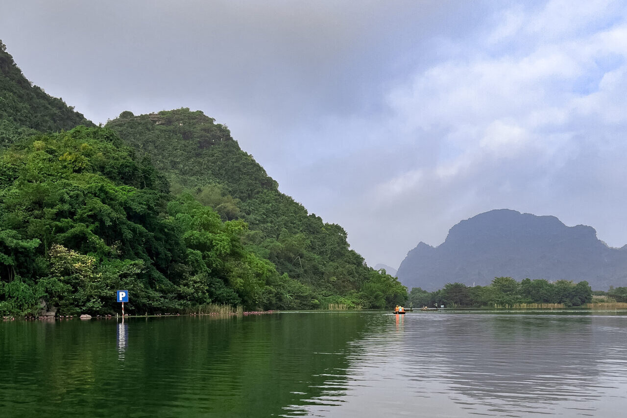 A large lake near the boat departure area of Trang An Landscape Complex in Ninh Binh, Vietnam