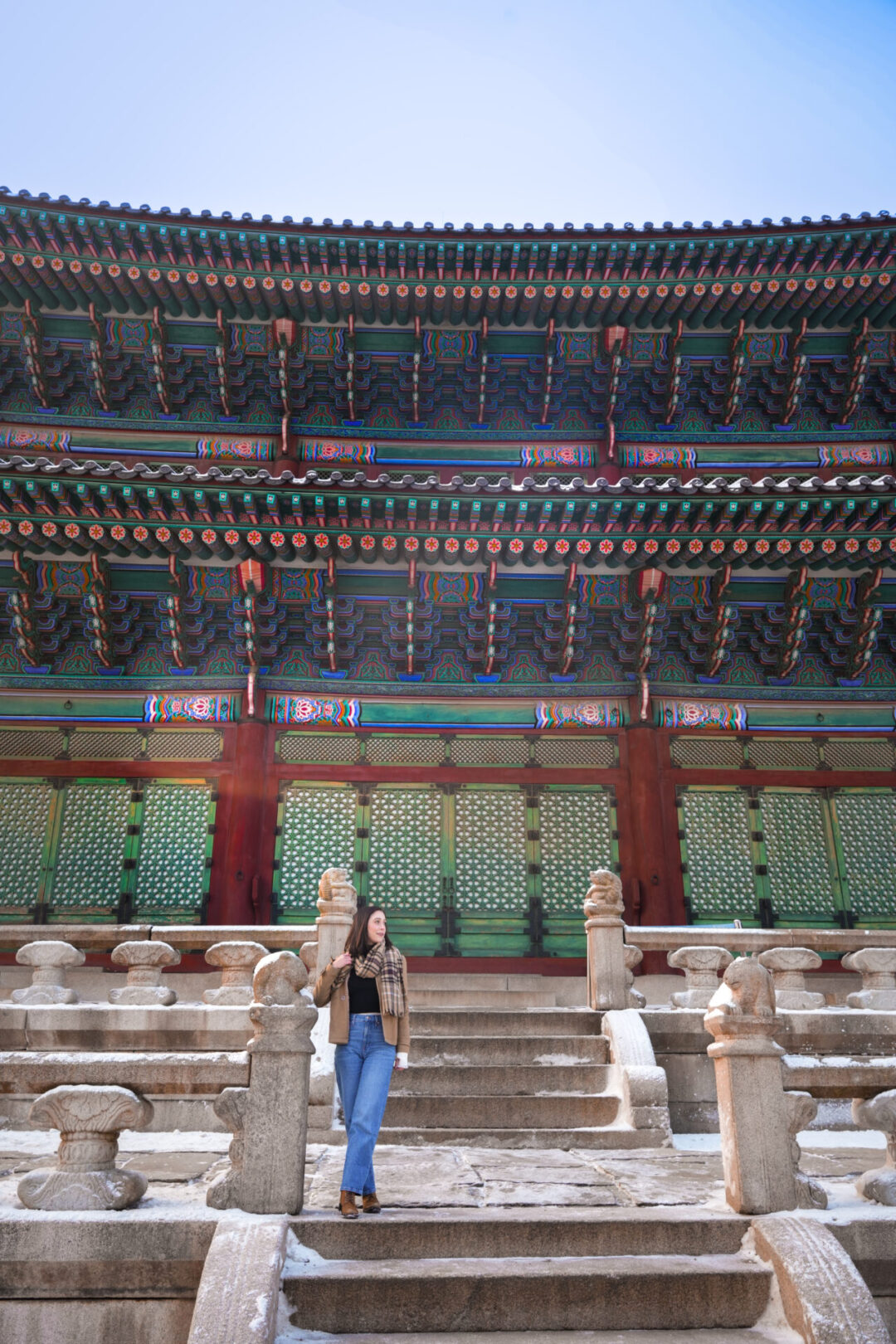 Travel Blogger Jordan Gassner standing on top of deck around Geunjeongjeon Hall inside Gyeongbokgung Palace in Seoul, South Korea