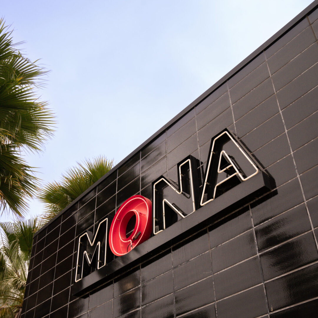 A neon "MONA" sign on the the Museum of Neon Art building in Glendale, California