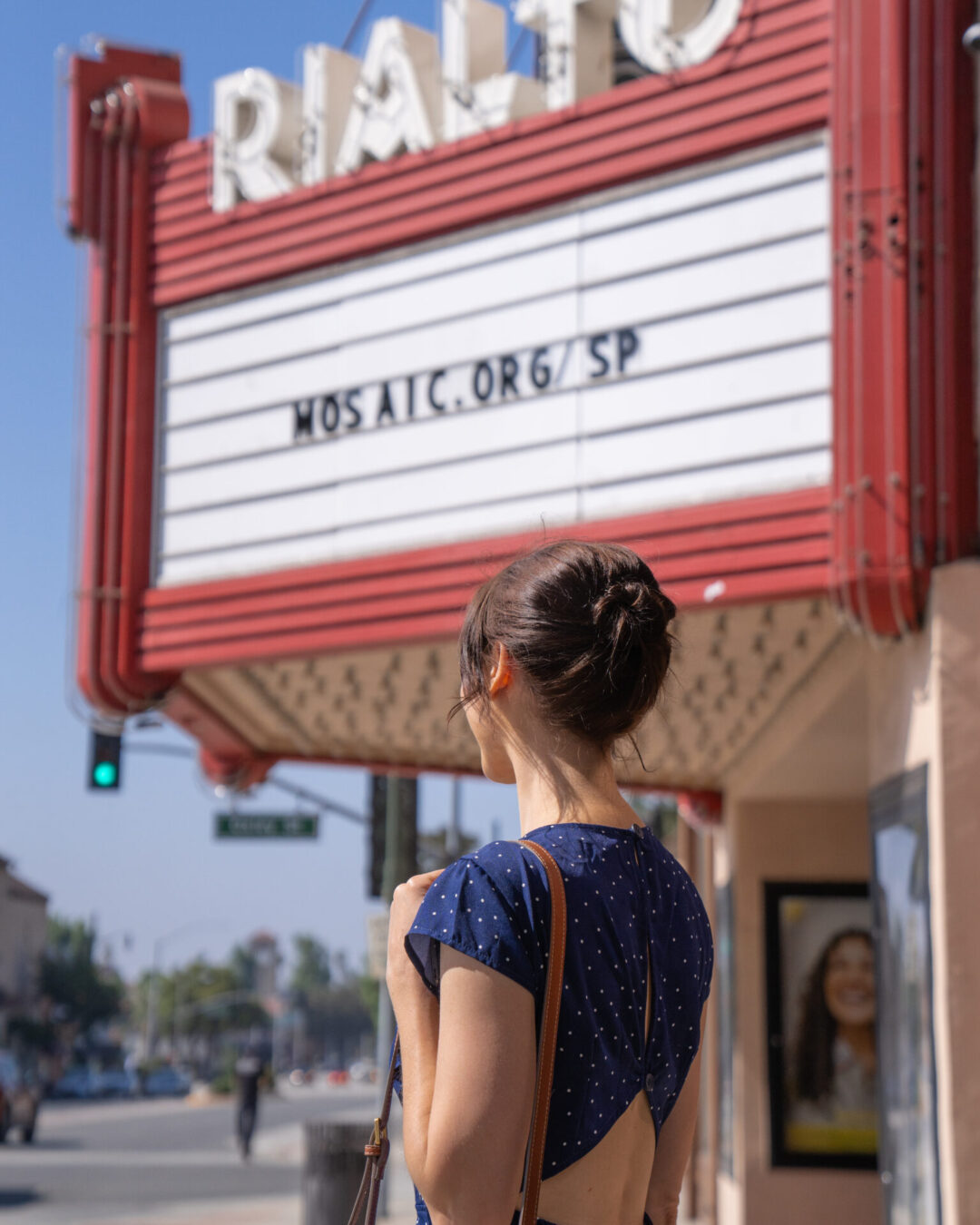 La La Land Travel Guide: Travel Blogger Jordan Gassner standing in front of the vintage Rialto Theatre sign in South Pasadena, California