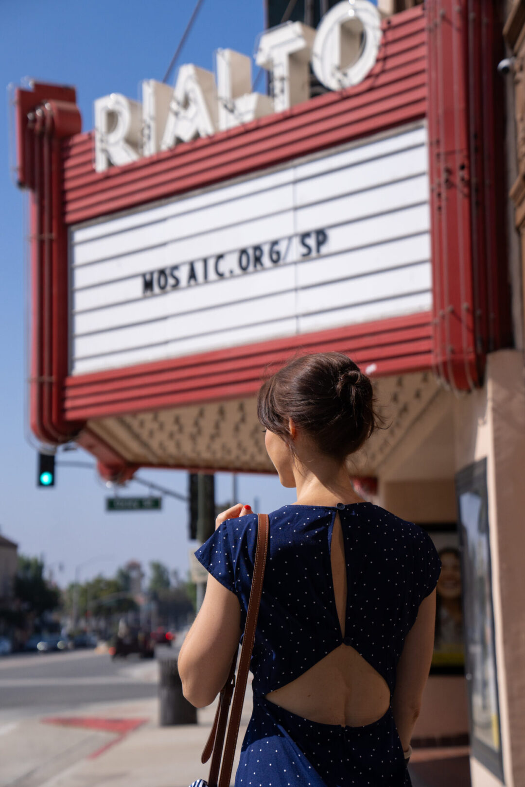 Travel Blogger Jordan Gassner walking toward the historic Rialto Theater in South Pasadena, one of the filming locations in La La Land
