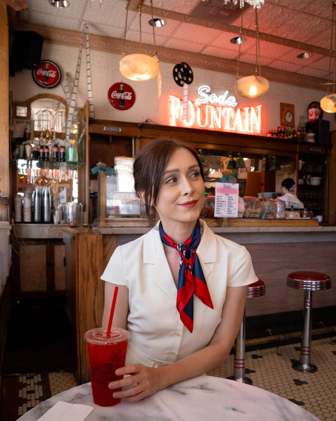 Back To The Future Travel Guide: Travel Blogger Jordan Gassner enjoying a phosphate soda inside Fair Oaks Pharmacy and Soda Bar in South Pasadena