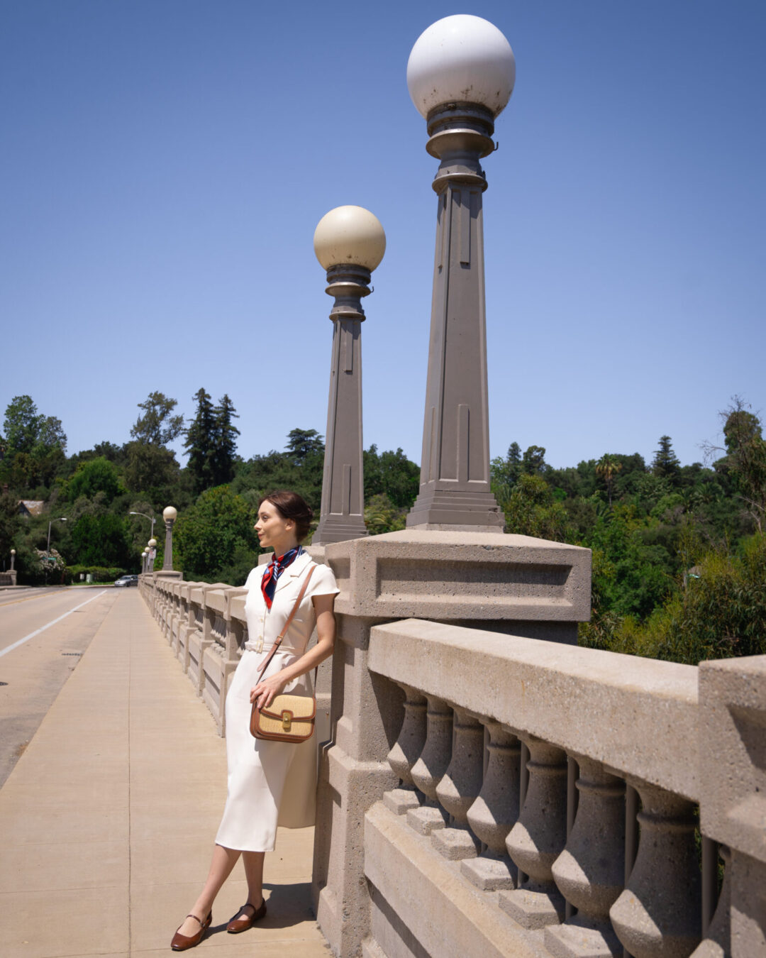 La La Land Travel Guide: Travel Blogger Jordan Gassner leaning against the railing at La Loma Bridge in Pasadena, California