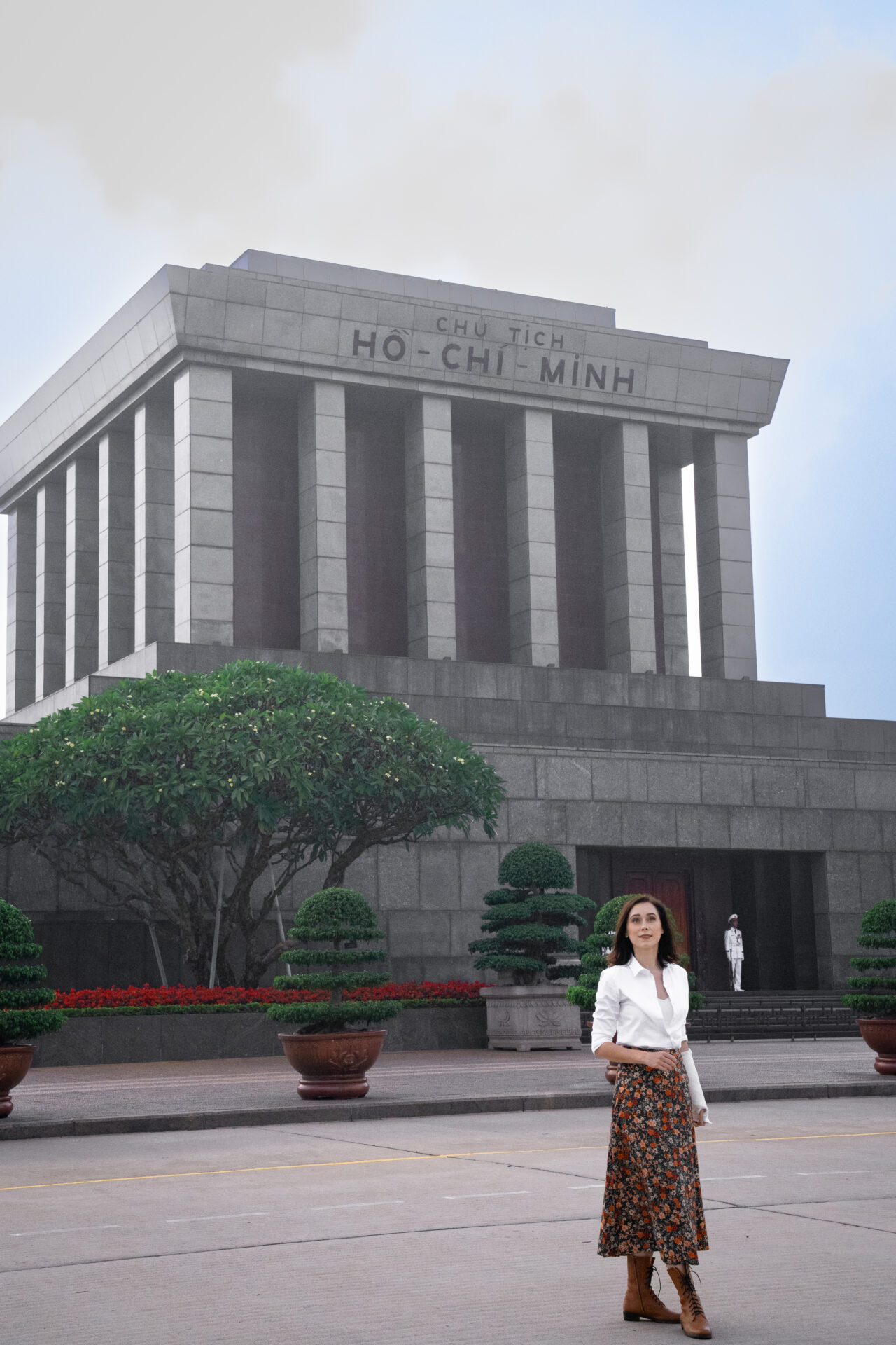 Travel Blogger Jordan Gassner standing in front of Ho Chi Minh Mausoleum in Hanoi, Vietnam