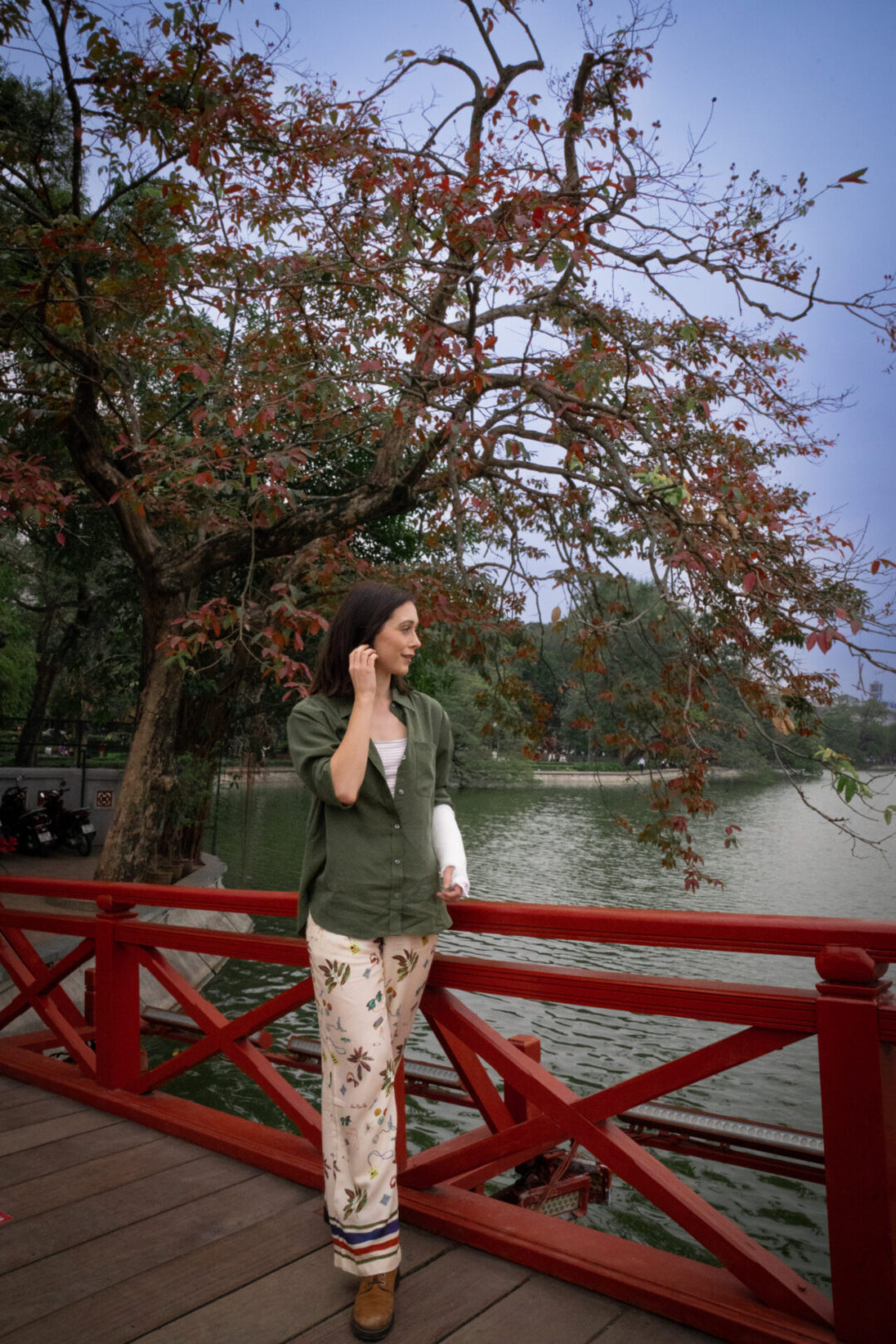 Travel Blogger Jordan Gassner looking out over Hoan Kiem Lake in Hanoi, Vietnam