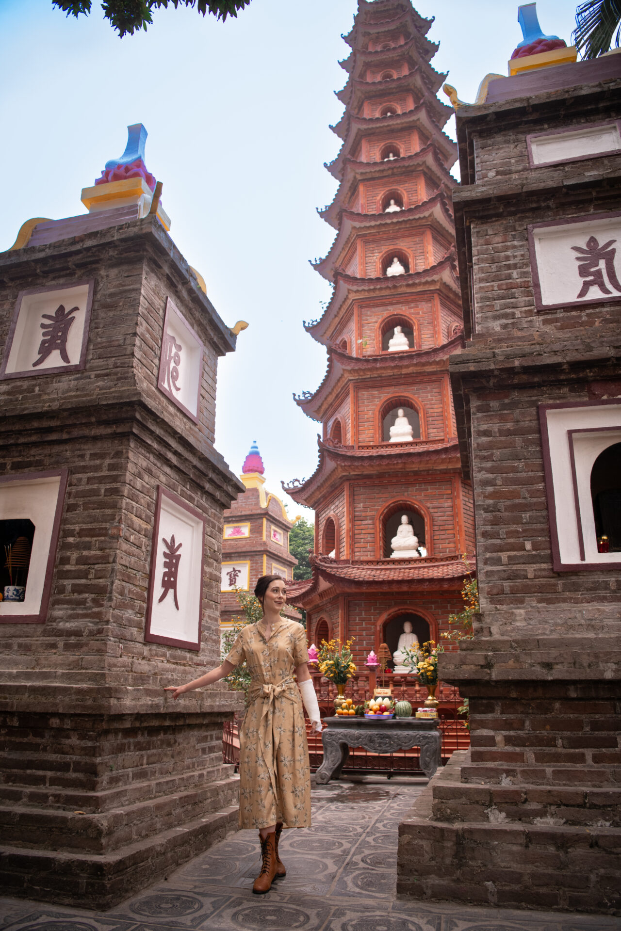 Travel Blogger Jordan Gassner standing underneath to Tran Quoc Pagoda in Hanoi, Vietnam