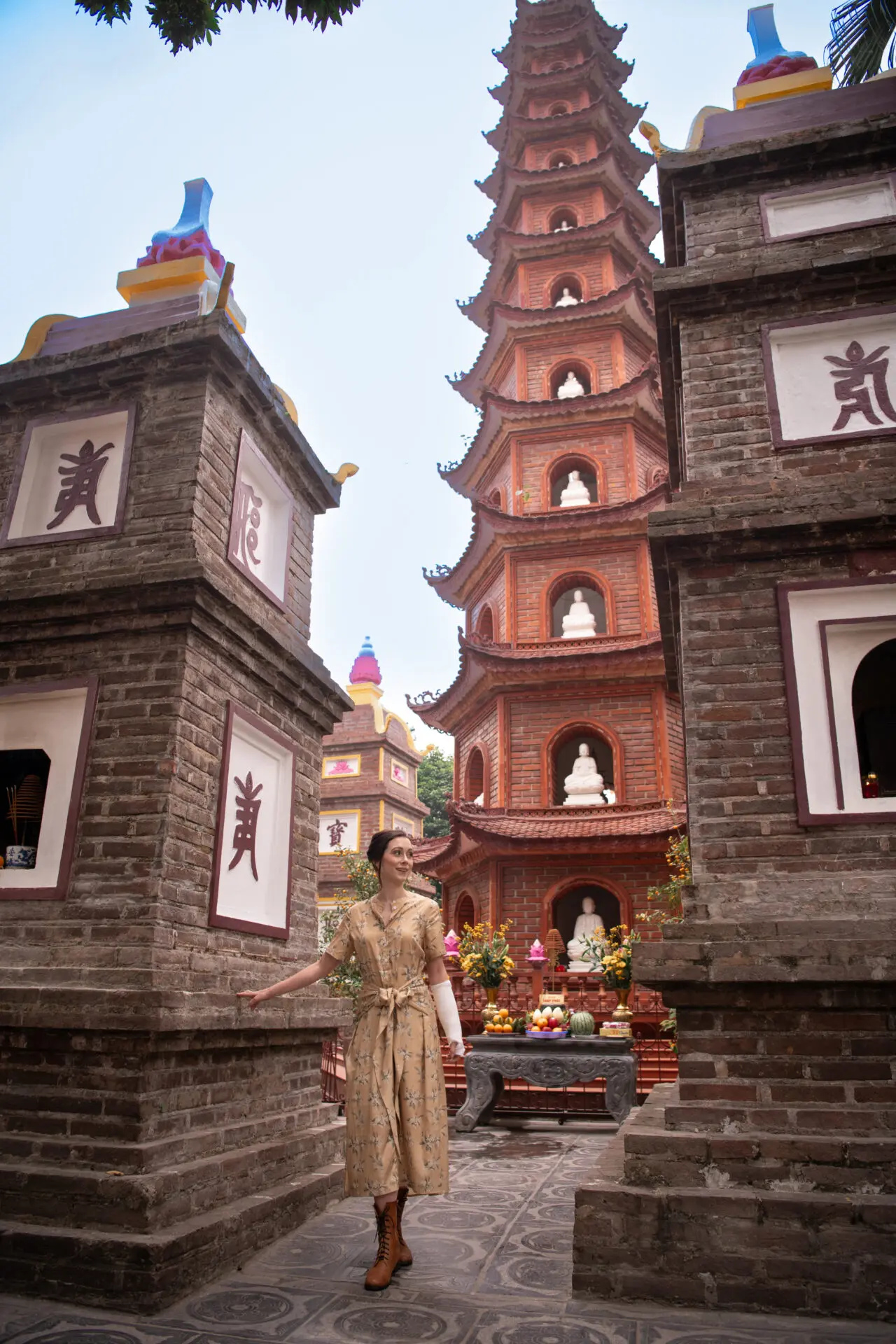 Travel Blogger Jordan Gassner standing underneath to Tran Quoc Pagoda in Hanoi, Vietnam