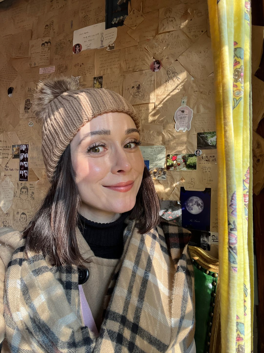 Travel Blogger Jordan Gassner smiling inside Whitebirch Story Tea House on her layover in Seoul, South Korea