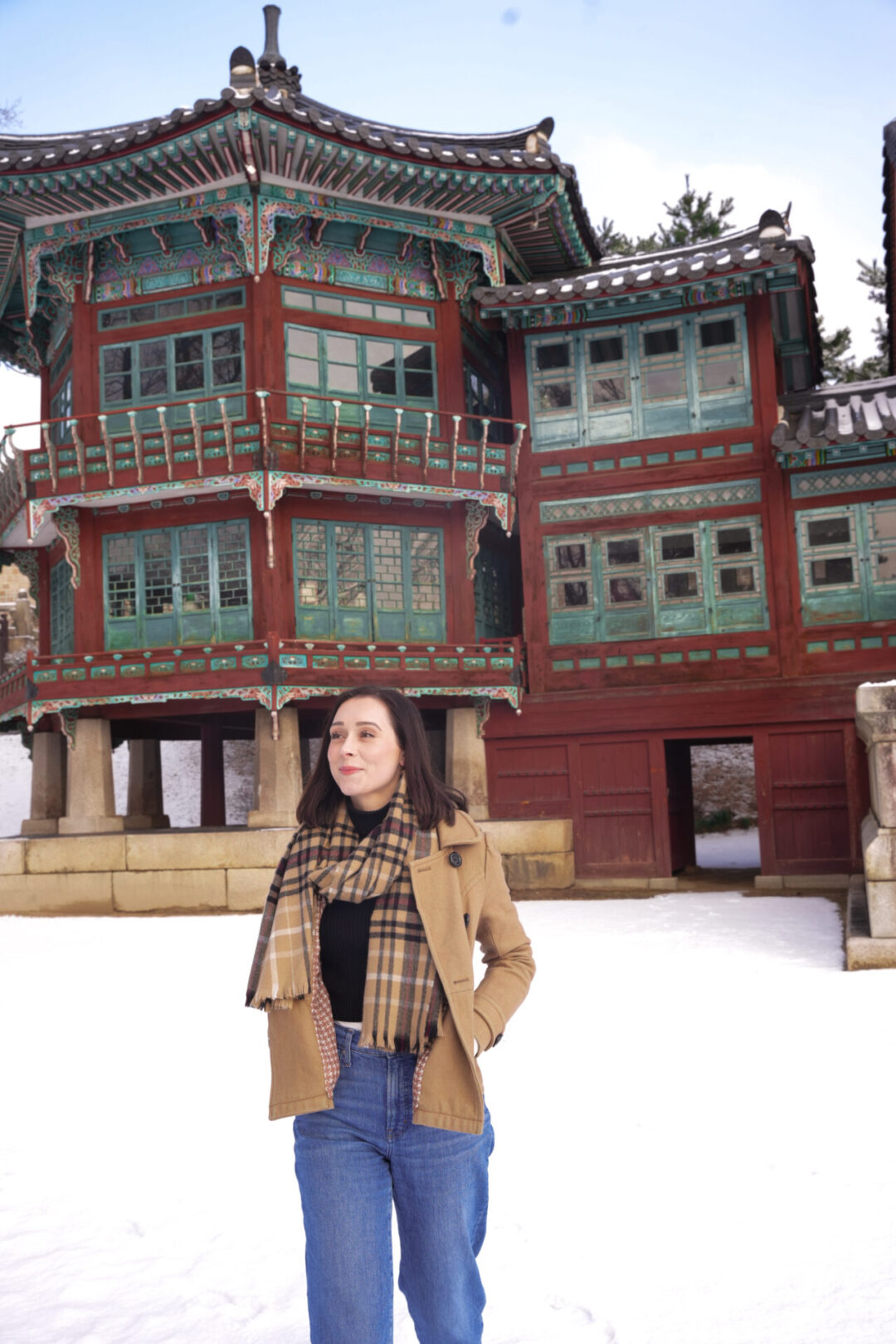 Gyeongbokgung Palace Photos: Travel Blogger Jordan Gassner smiling while walking around Jibokjae Hall in Seoul, South Korea