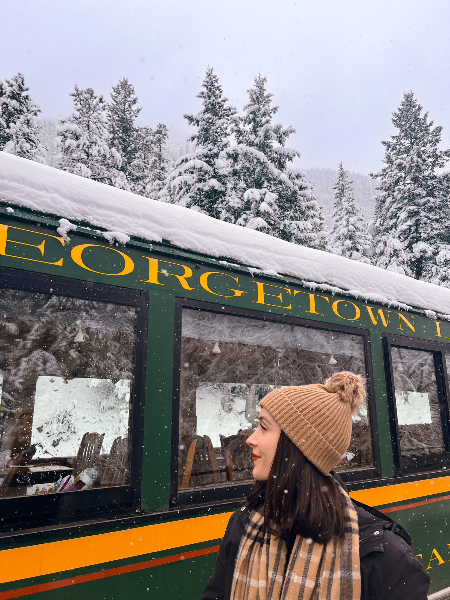Georgetown Colorado Travel: Travel Blogger Jordan Gassner looking at a Georgetown Loop Railroad train car in Colorado