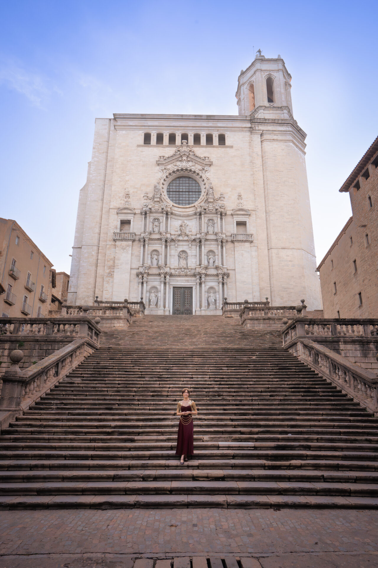 Travel Blogger Jordan Gassner standing on the steps leading up to Girona Cathedral in Catalonia, Spain