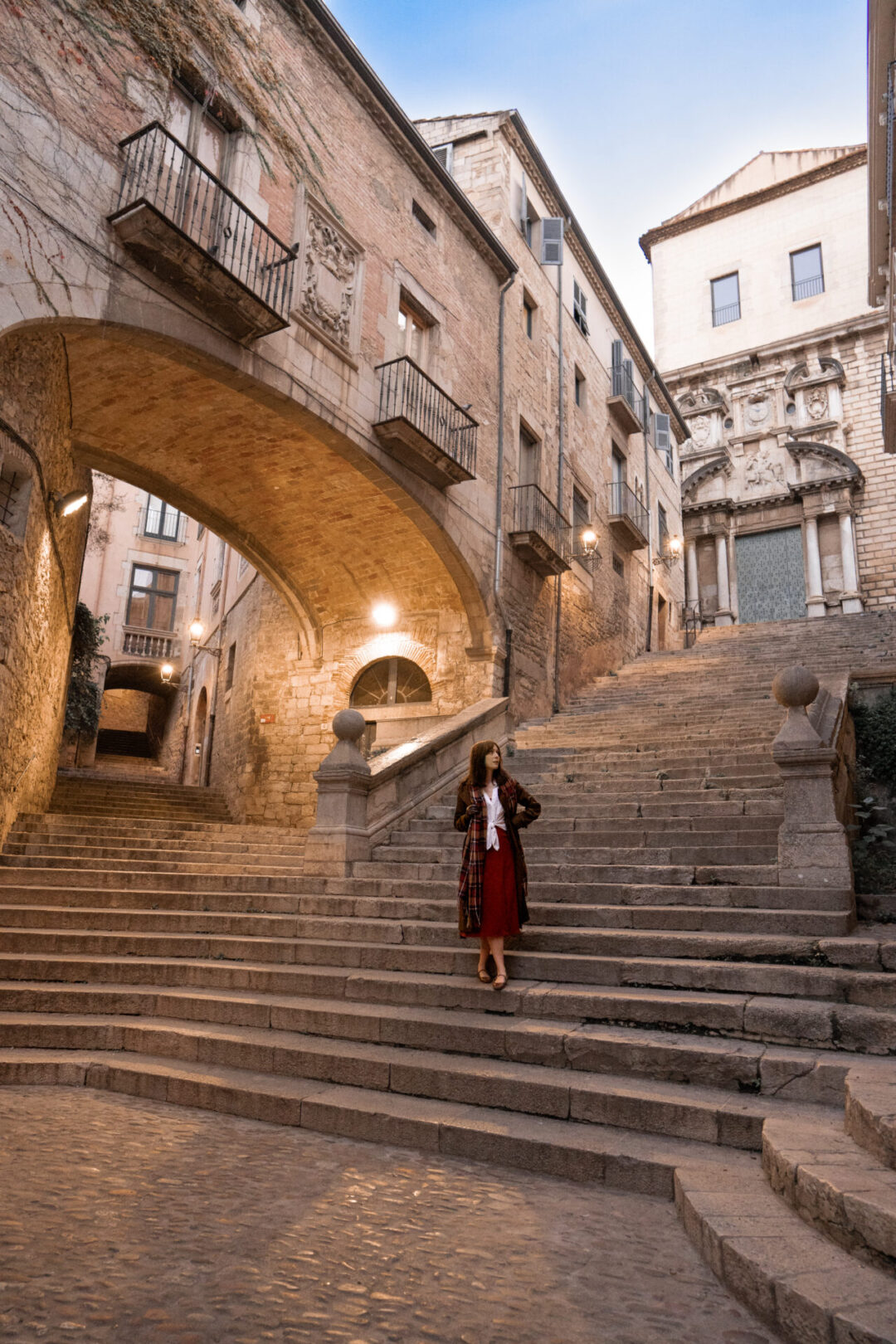 Travel Blogger Jordan Gassner standing on the Rise of Sant Domenec, a Game of Thrones filming location in Girona, Spain