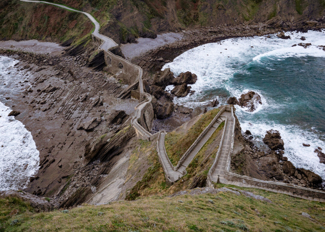 A birds eye view of the stone staircase leading up to the Gaztelugatxe islet summit in Bermeo, Basque Country, Spain, Europe