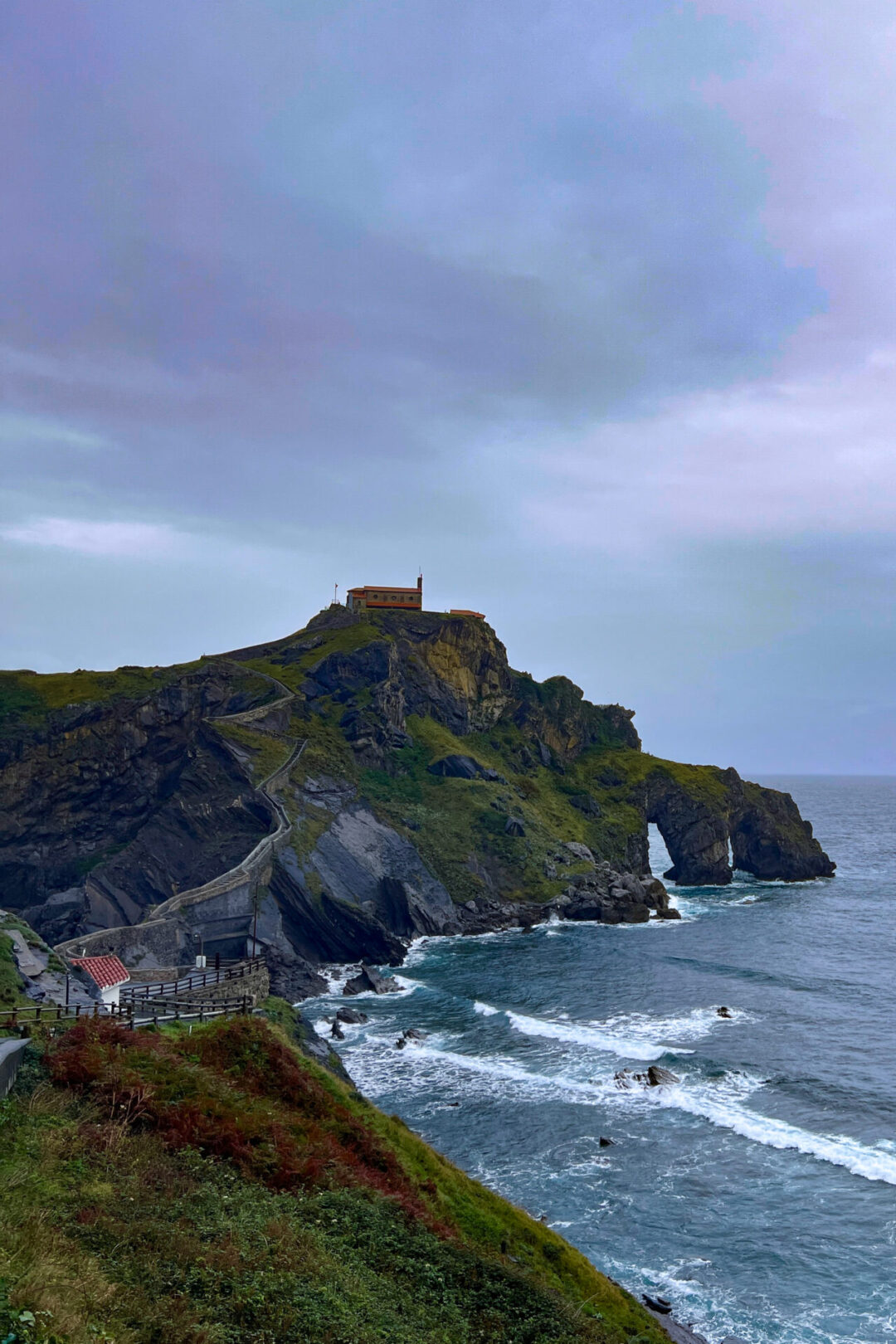 The green and lush Basque coastline near San Juan de Gaztelugaxe in Spain