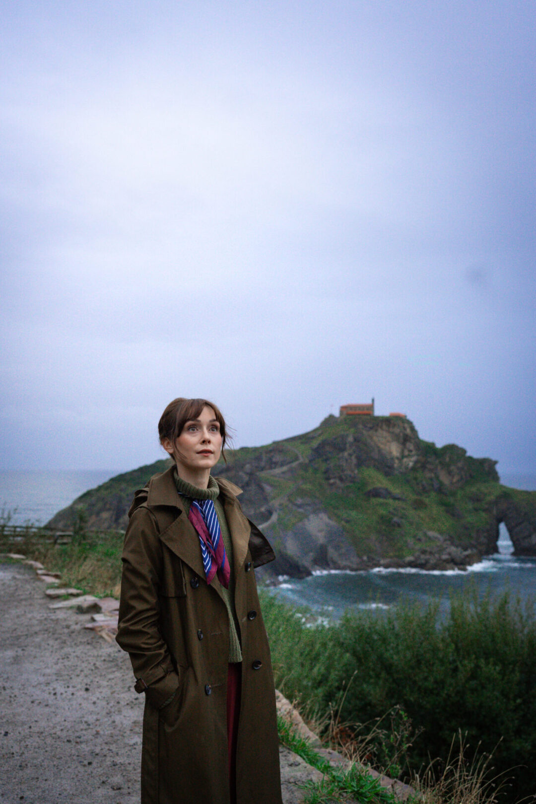 Travel Blogger Jordan Gassner taking in the views of the coastline near the islet of San Juan de Gaztelugatxe in Spain