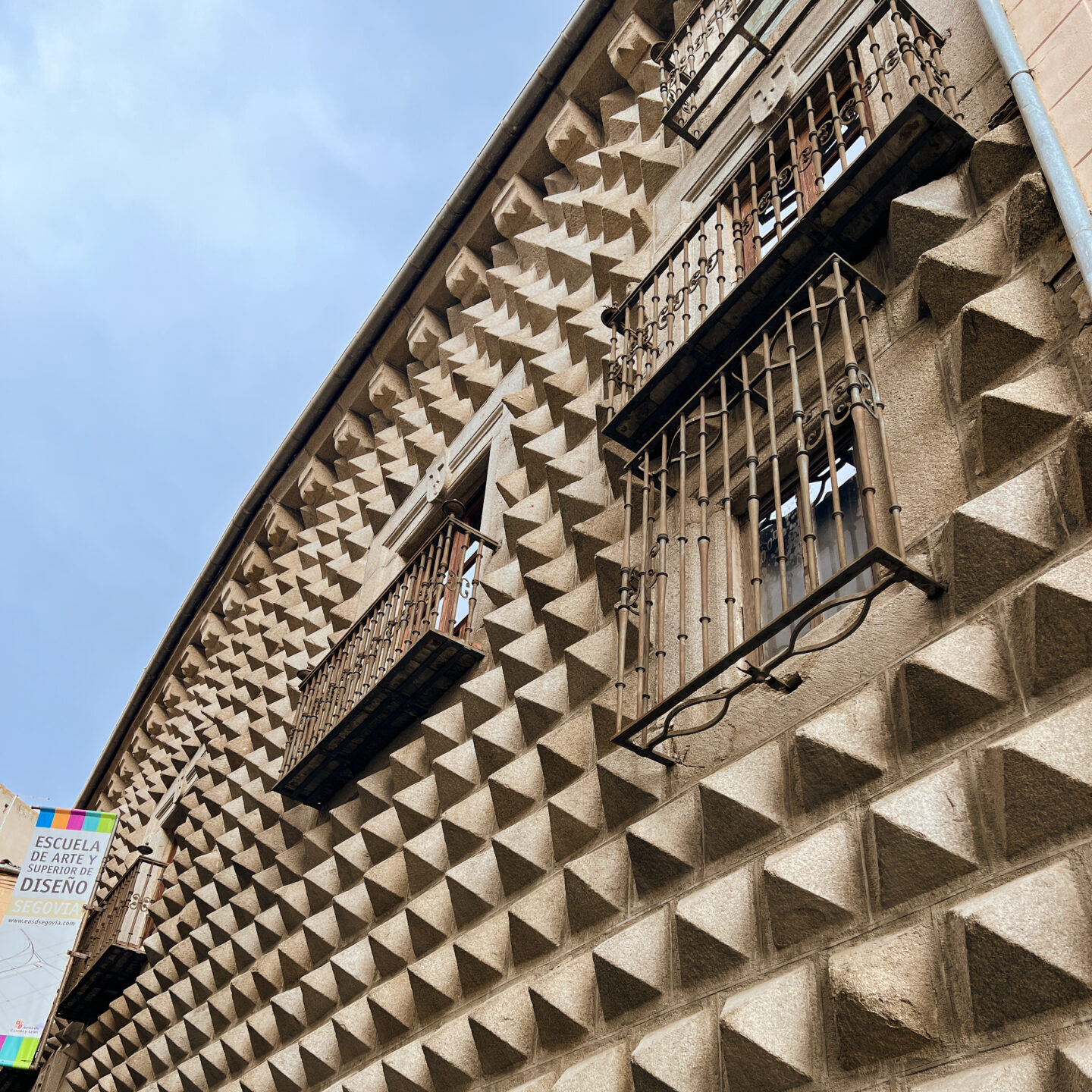The exterior of the spike-covered building known as Casa de los Picos in Segovia, Spain