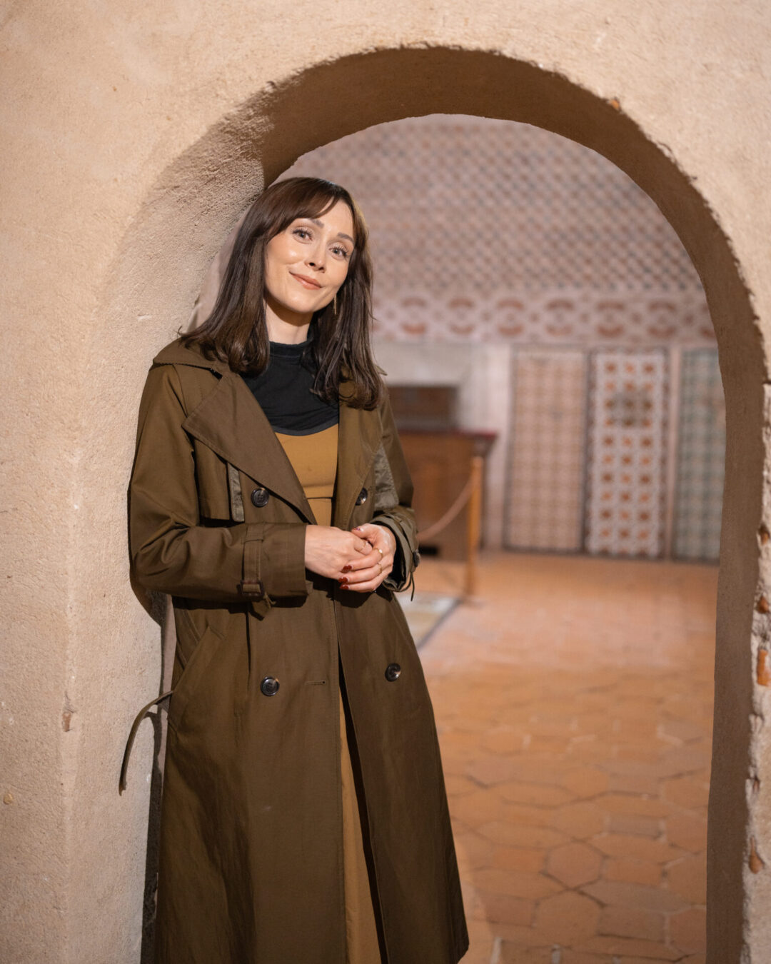 Travel Blogger Jordan Gassner standing in a doorway in one of the towers inside the medieval Castillo de Coca near Segovia, Spain