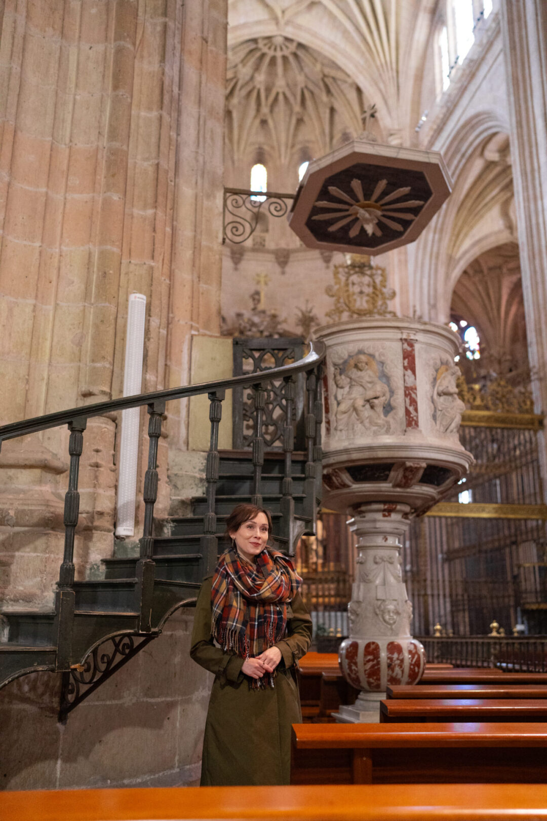Travel Blogger Jordan Gassner standing inside the nave of the Segovia Cathedral in Spain
