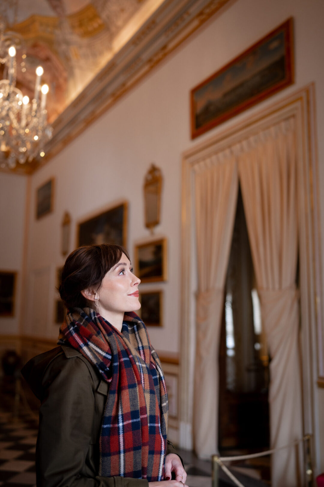 Travel Blogger Jordan Gassner admiring a piece of artwork inside the Royal Palace of La Granja of San Ildefonso in Segovia, Spain