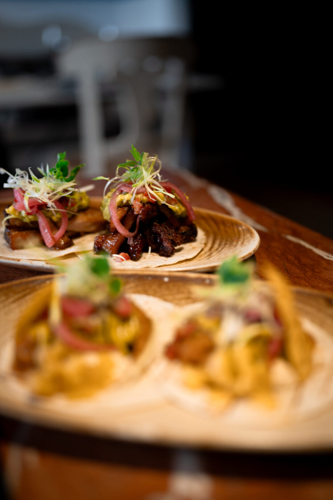 Toledo Spain Travel Guide: Two plates filled with different types of tacos from Alfileritos 24, a creative tapas restaurant in Toledo, Spain