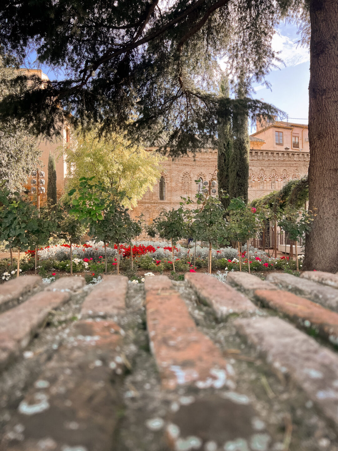 The garden outside La Mezquita del Cristo de la Luz on a warm, sunny fay in Toledo, Spain