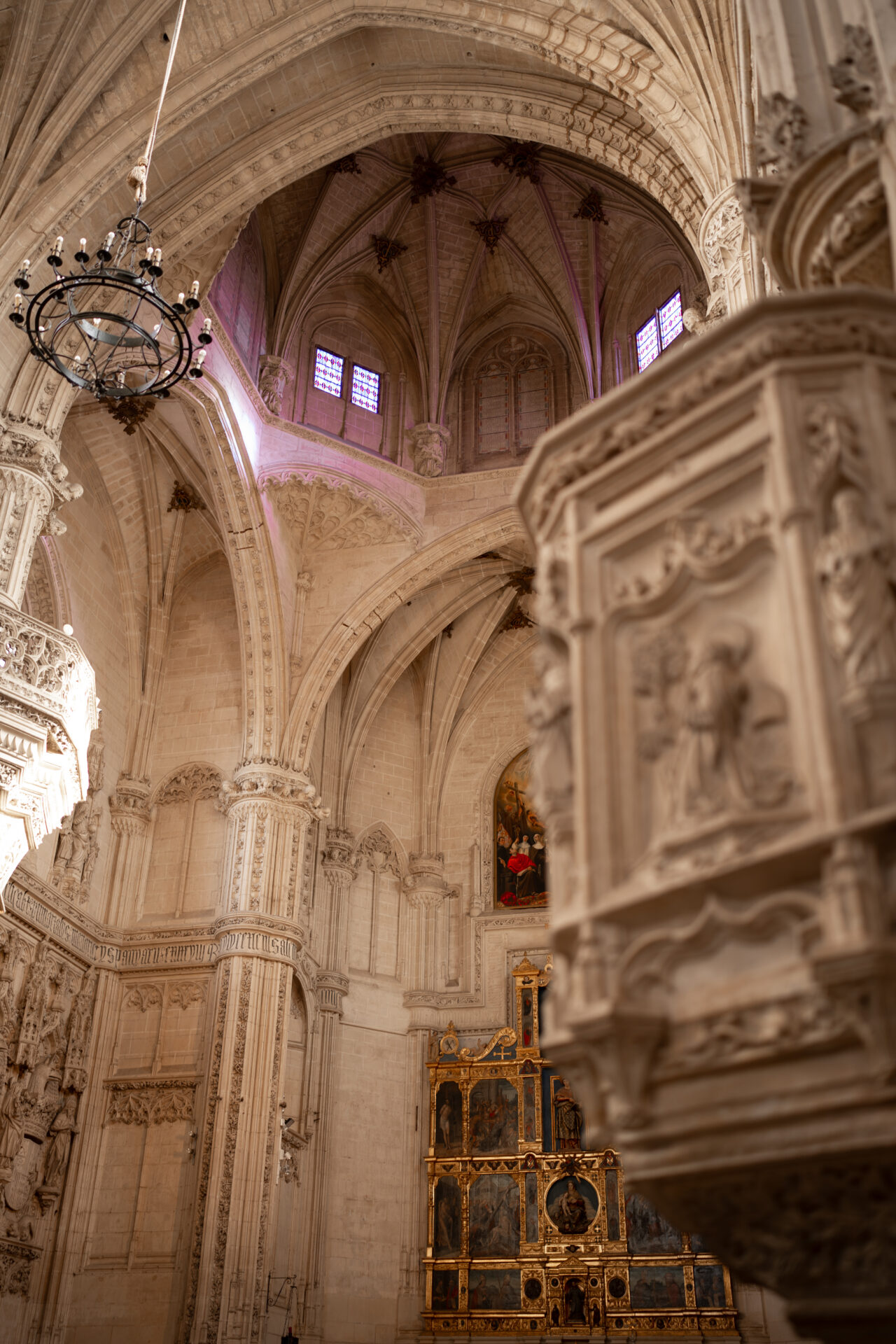 A first floor view upwards at the ceiling above and surrounding the altar at the  Monastery of San Juan de los Reyes in Toledo, Spain