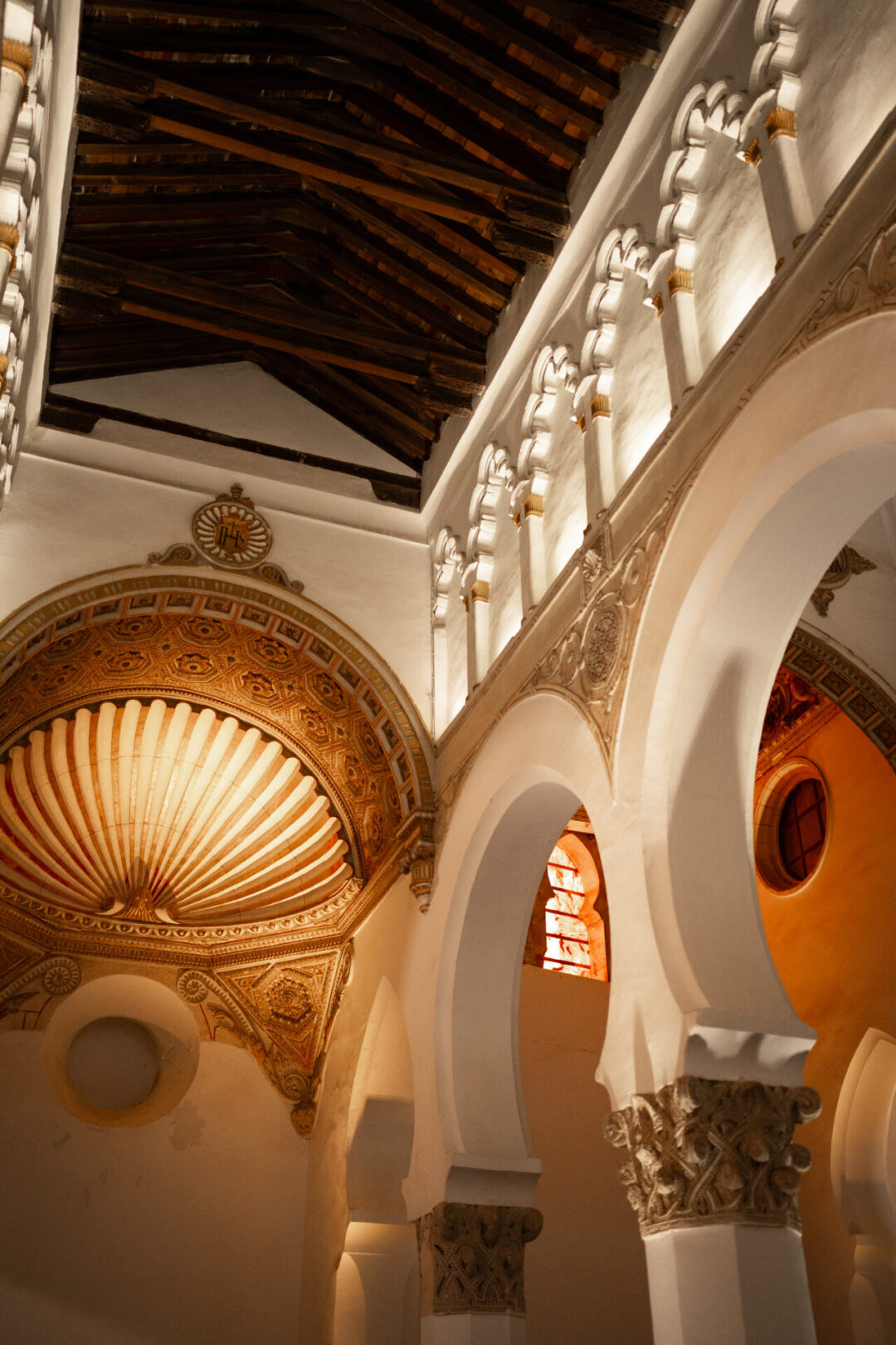 The gold, shell-shaped altar inside Sinagoga de Santa María La Blanca, a 13th century synagogue in Toledo, Spain