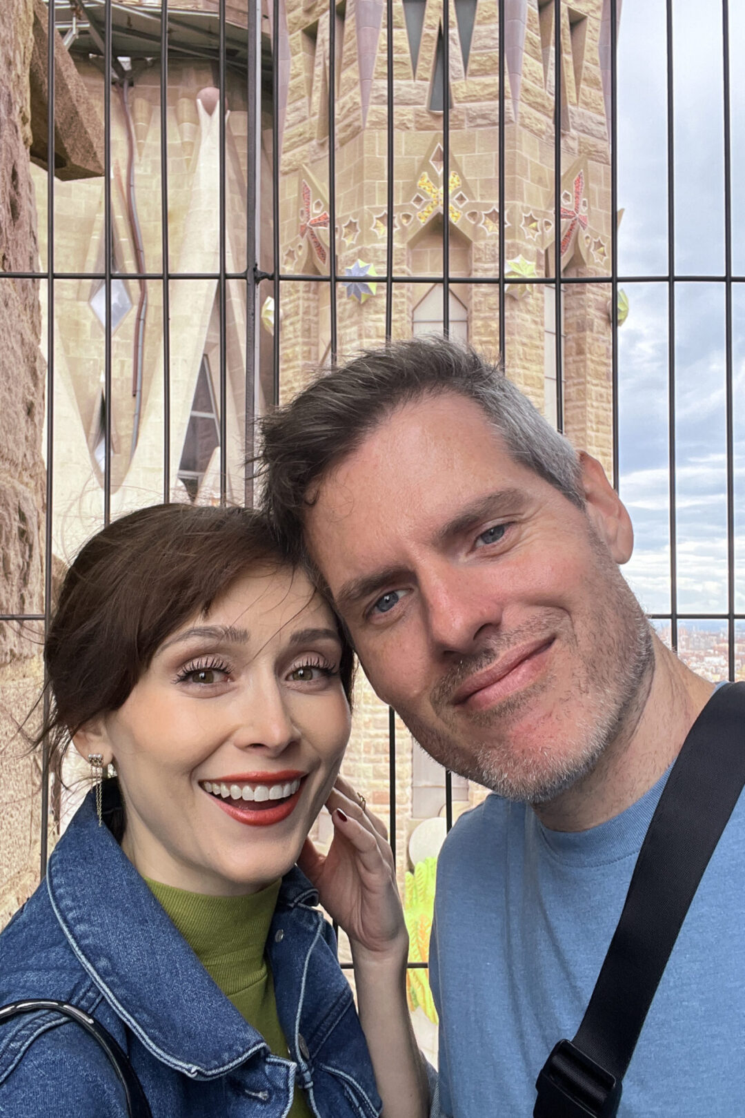 Travel Blogger Jordan Gassner and her partner atop one of the tower lookouts at La Sagrada Familia in Barcelona, Spain