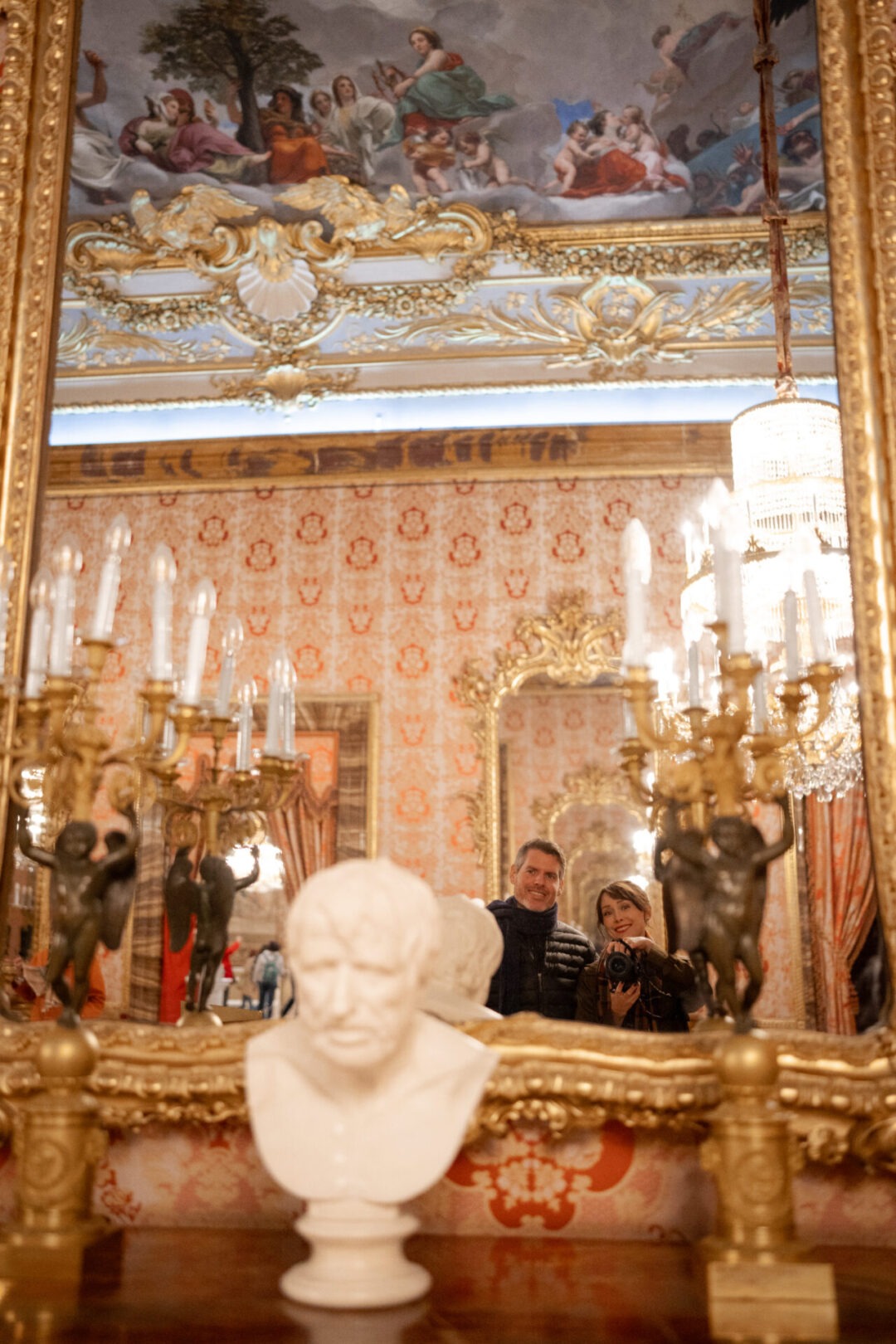 Travel Blogger Jordan Gassner and her partner taking a selfie at a mirror in the Presidential Palace in Madrid, Spain