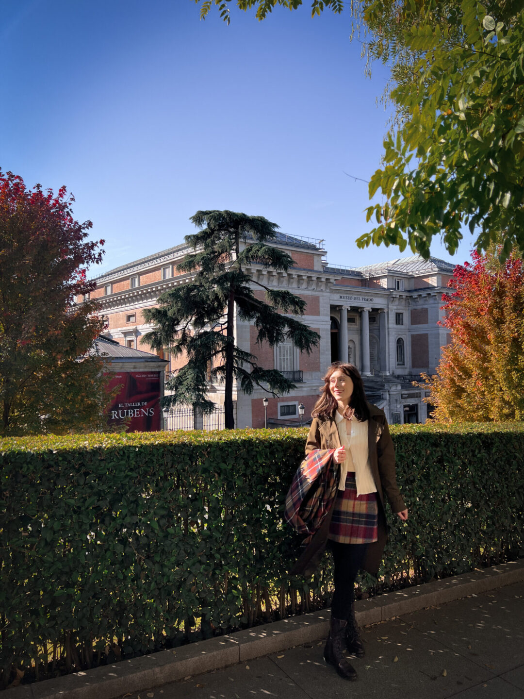 Travel Blogger Jordan Gassner smiling in front of Museo Nacional del Prado in Madrid, Spain