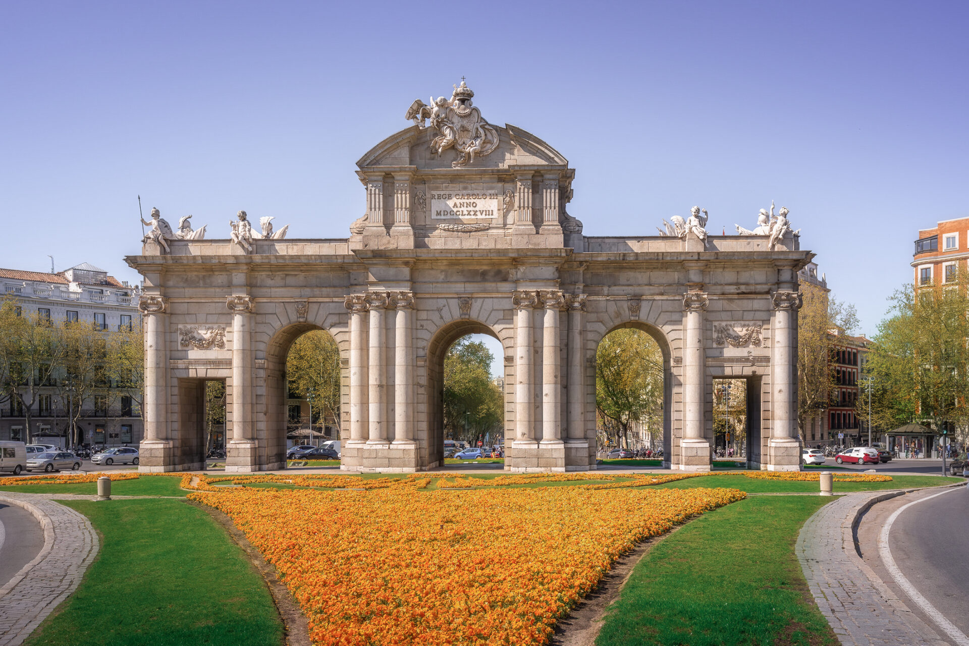 Orange blooms in front of Puerta de Alcala in Madrid, Spain