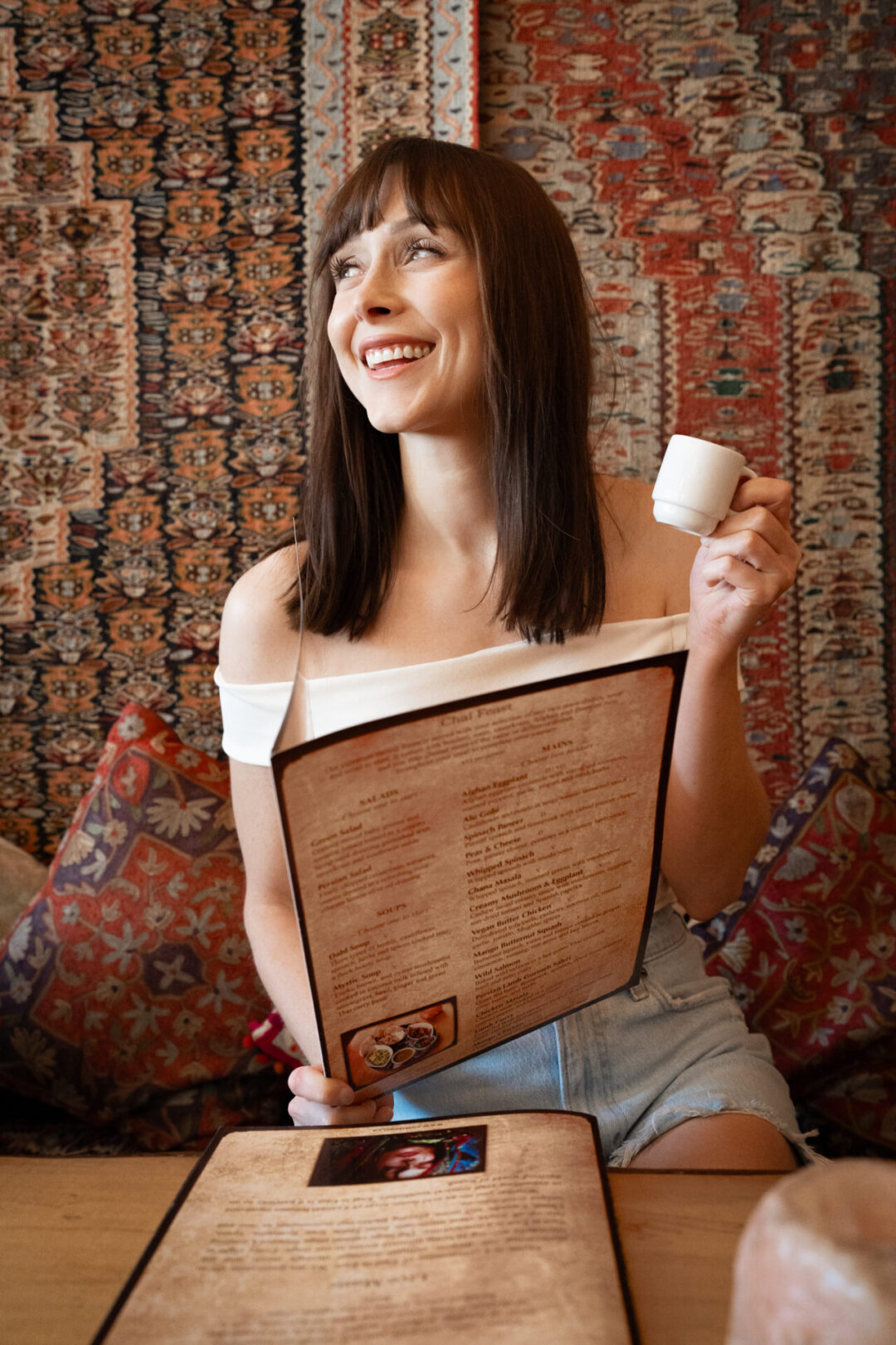 Best places to eat in Vancouver for first-timers: Travel Blogger Jordan Gassner enjoying a chai sample from East is East in Vancouver