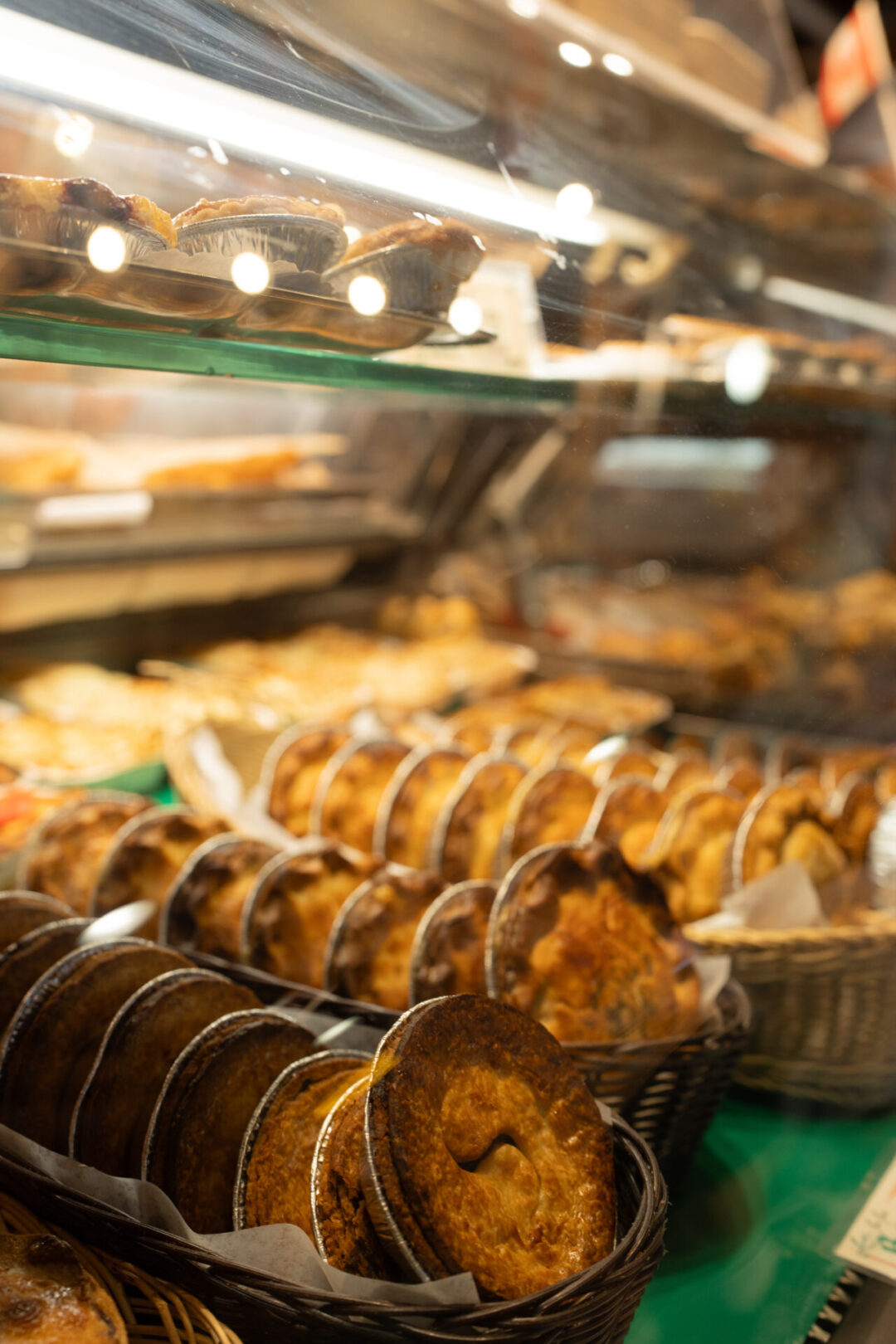 A display case with mini pies inside Granville Island Public Market in Vancouver, Canada