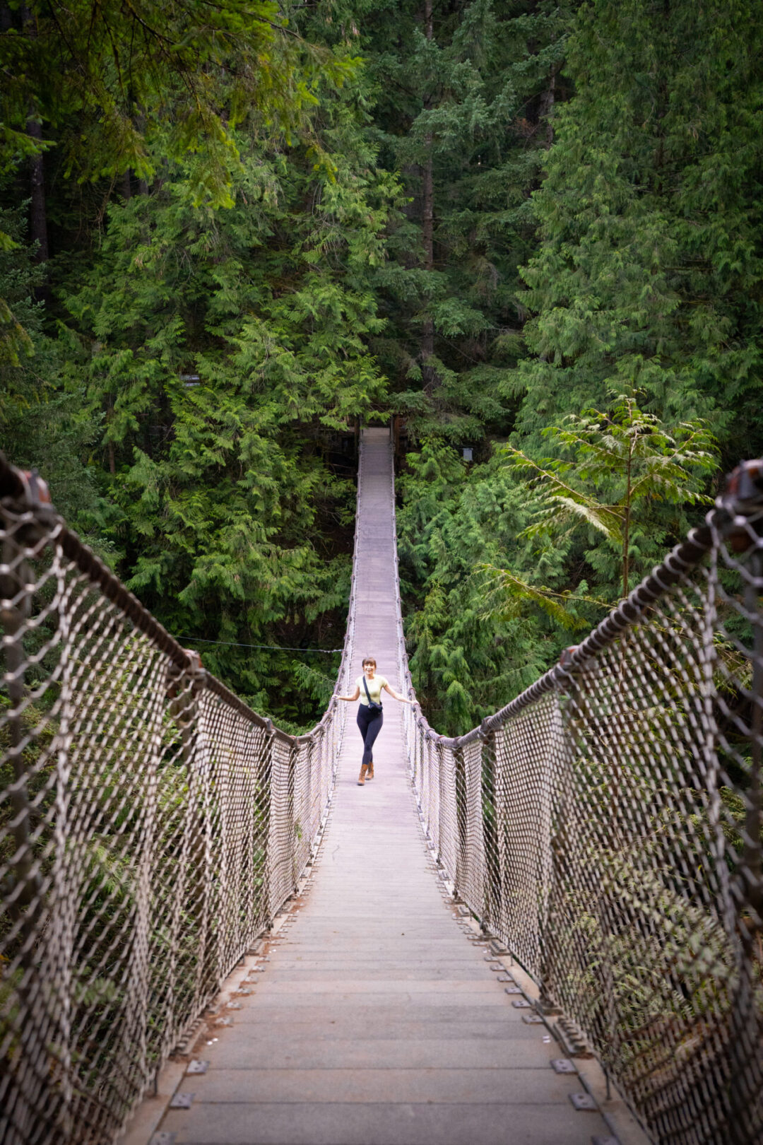 Vancouver Neighborhoods: Travel Blogger Jordan Gassner hanging out on the Lynn Canyon Suspension Bridge in North Vancouver