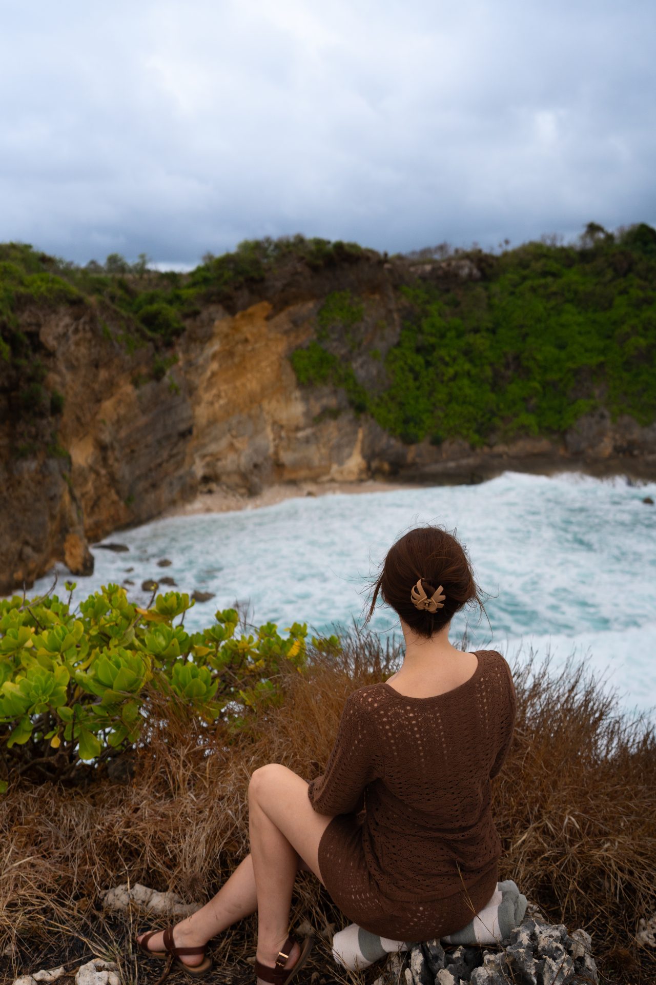 Travel Blogger Jordan Gassner looking over Mareha Cape on the island of Sumba, Indonesia