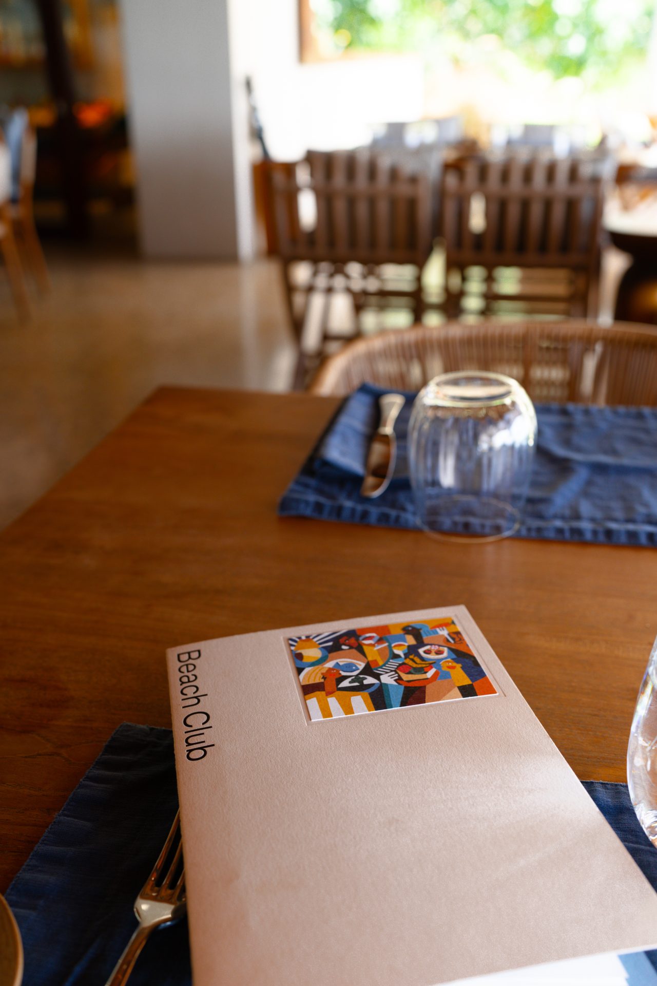 A Beach Club menu on a table at Cap Karoso resort in Sumba, Indonesia